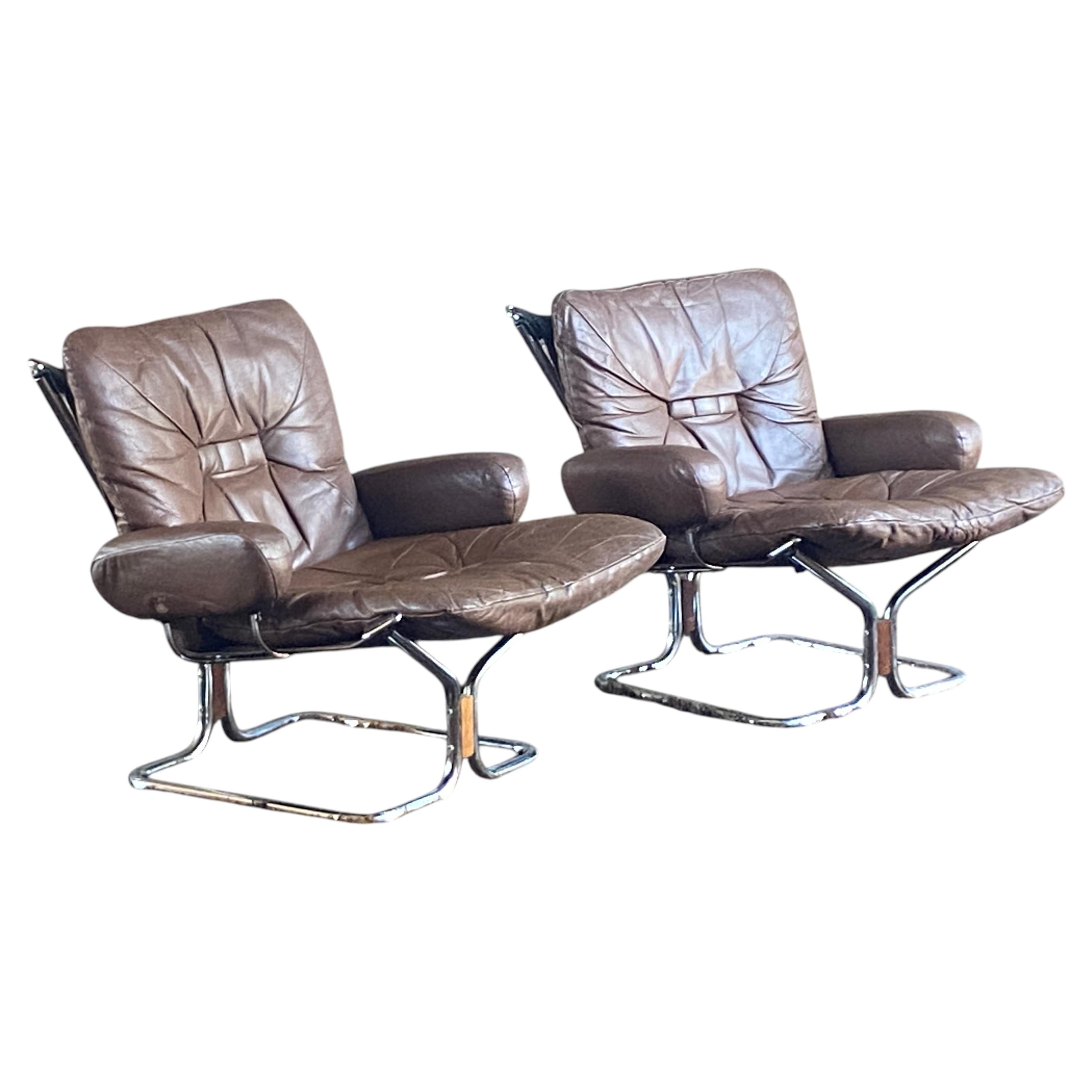 Pair of Norwegian leather and chrome Harald Relling lounge chairs for Westnofa