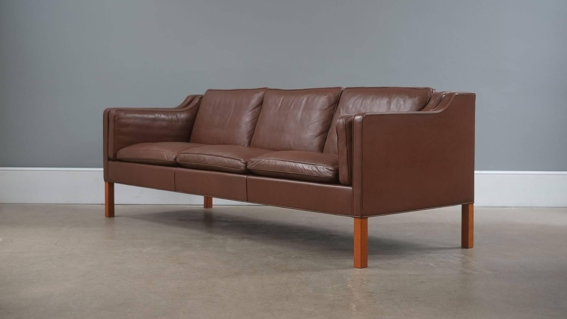 The real thing… fantastic example of the Classic three-seat sofa designed by Børge Mogensen for Fredericia, Denmark model 2213. Unsurpassed quality and in beautiful brown leather with solid teak legs. Wonderful example.
 