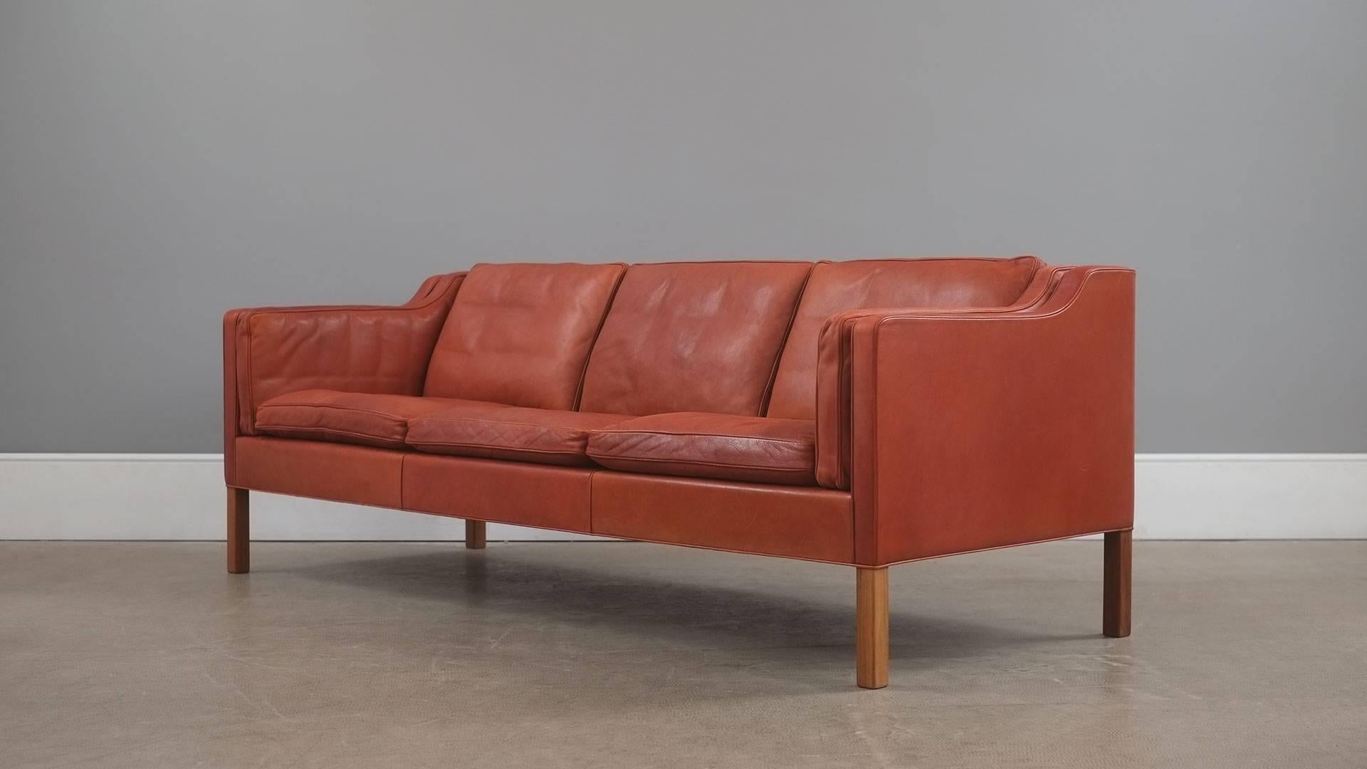 The real thing… Fantastic early example of the Classic three-seat sofa designed by Børge Mogensen for Fredericia, Denmark model 2213. This example in wonderful and super rare thick cognac analine leather with perfect patina. Originally purchased in