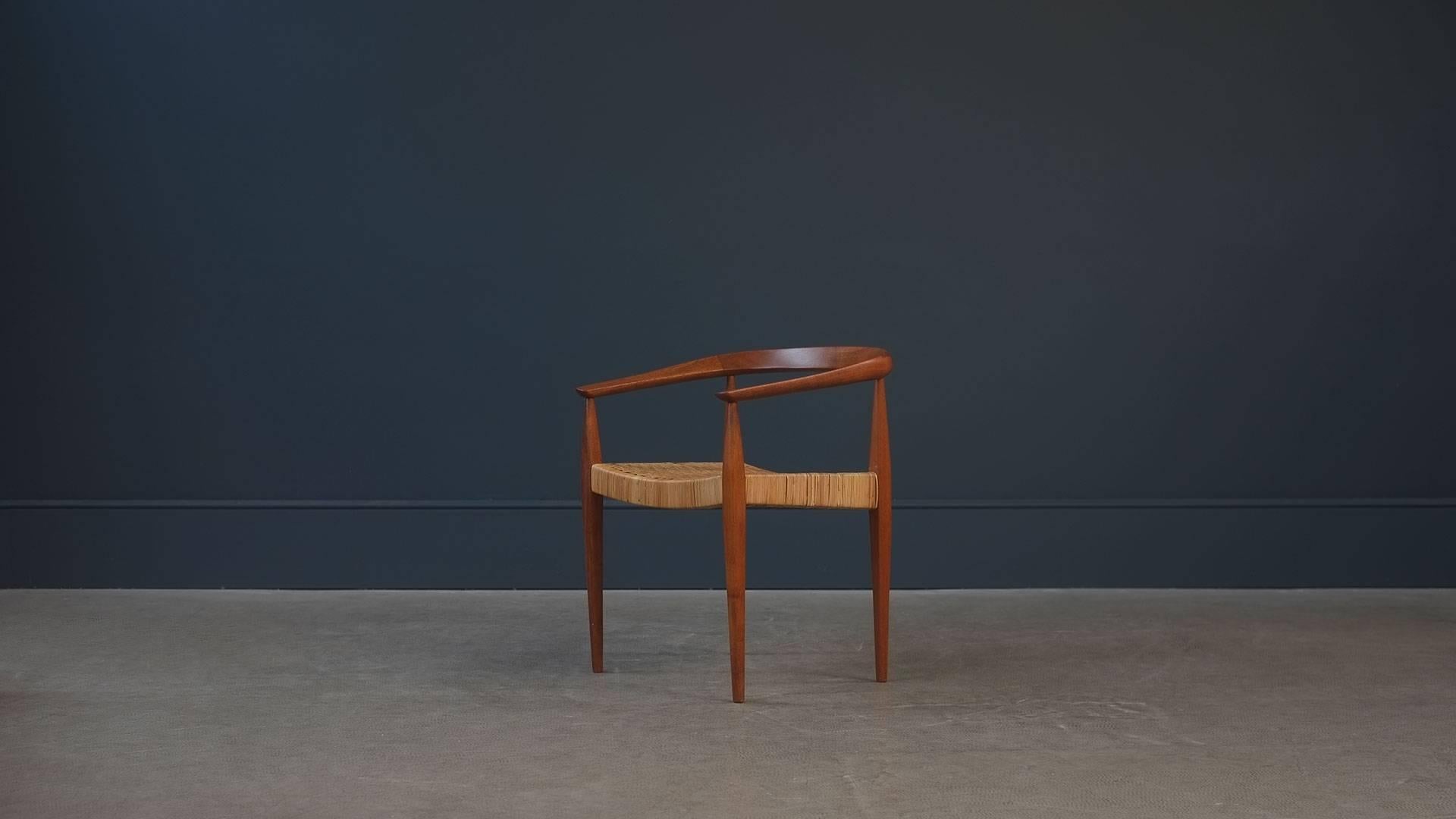 Very rare and beautiful early occasional chair in solid teak and original cane designed by Nanna Ditzel for Kolds Savvaerk, Denmark. Super sculptural chair in beautiful condition.
 