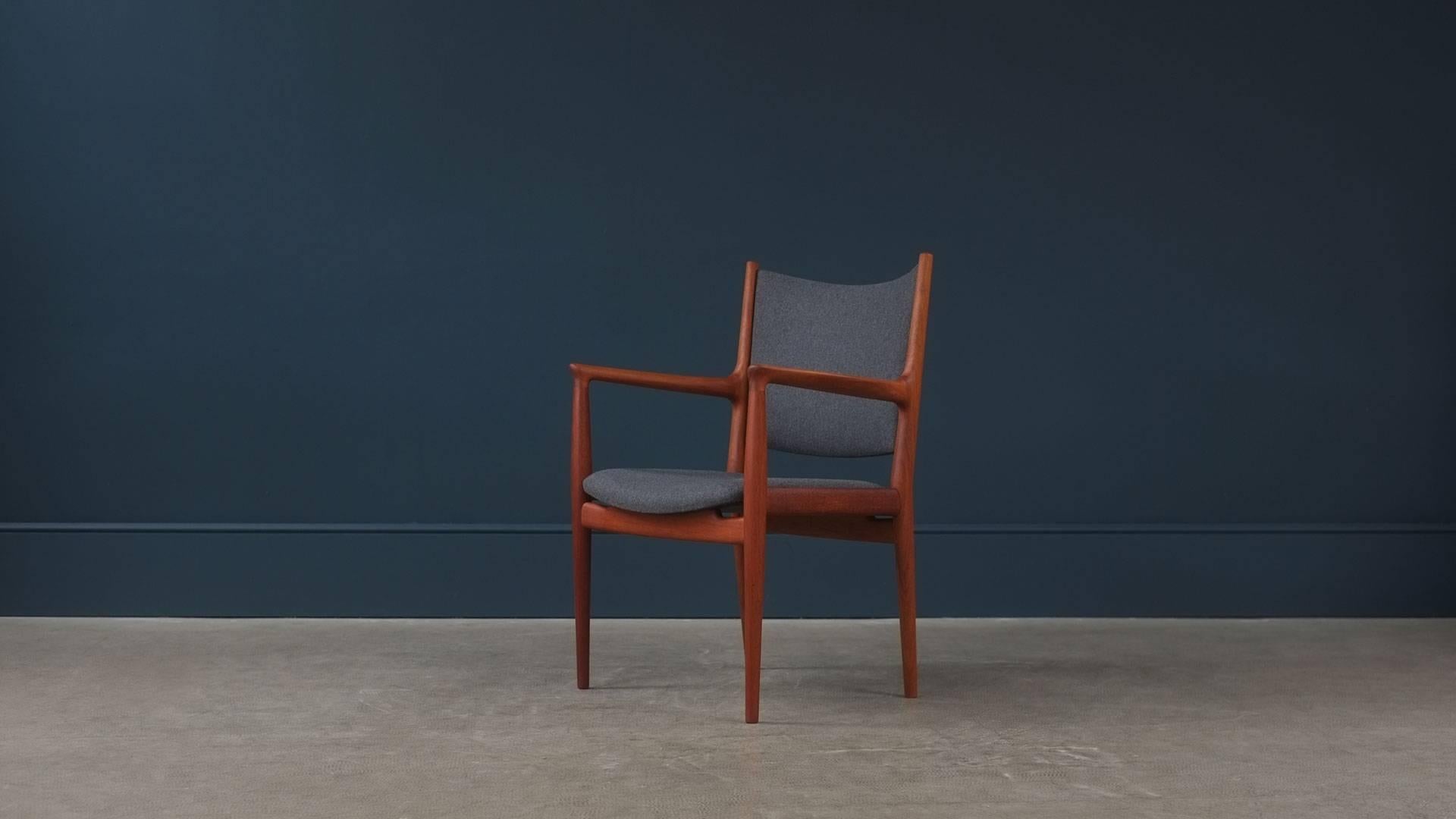Beautiful JH713 armchair in solid teak designed by Hans Wegner for cabinet maker Johannes Hansen, Denmark. Fully reconditioned and re-upholstered in fantastic grey wool. Wonderful quality and super elegant chair.