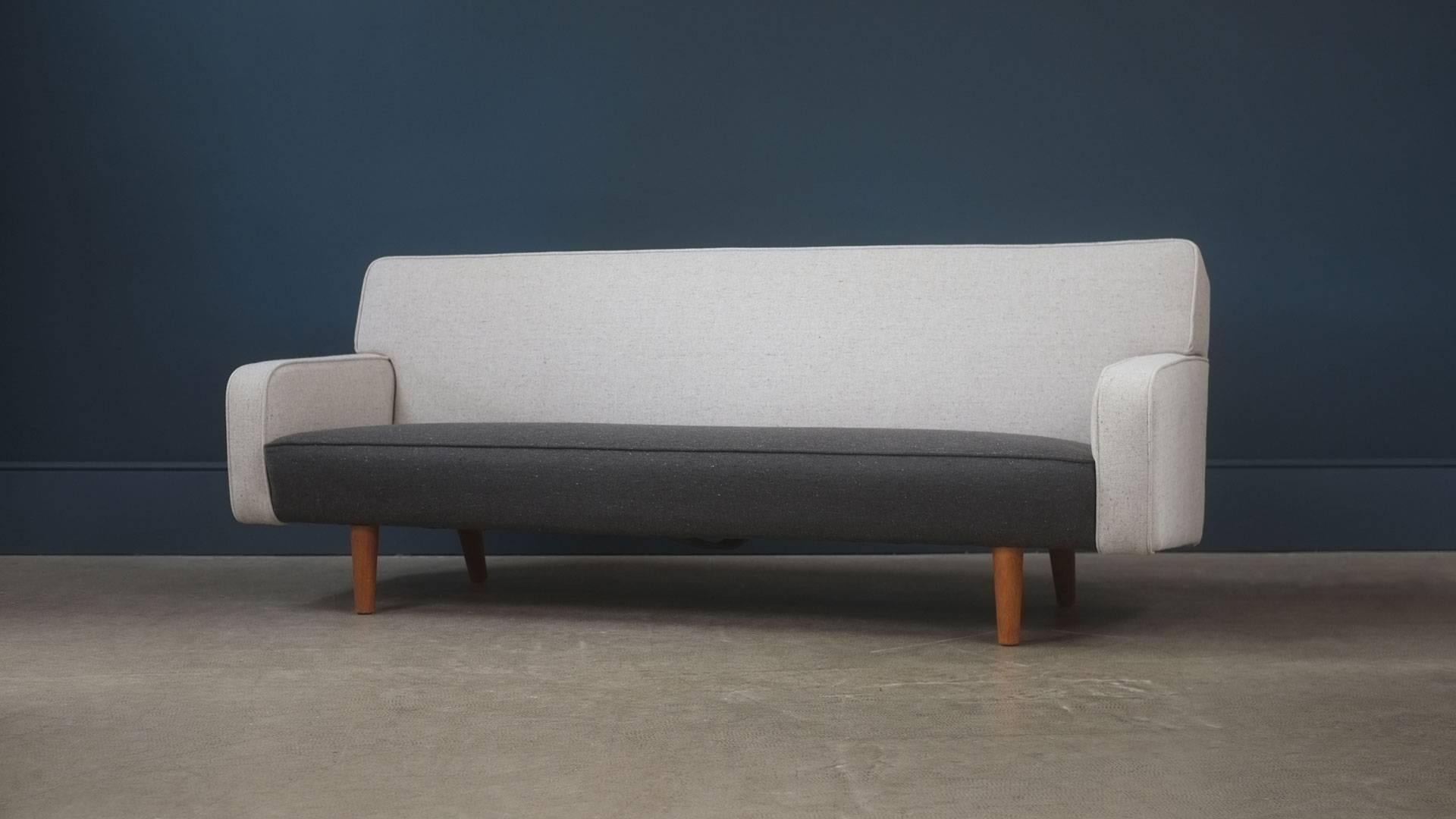 Ultra elegant sofa designed by Hans Wegner for cabinet maker AP Stolen, Denmark. Very comfortable sofa fully reconditioned and reupholstered in fabulous contrasting fleck fabric. Great piece.
 