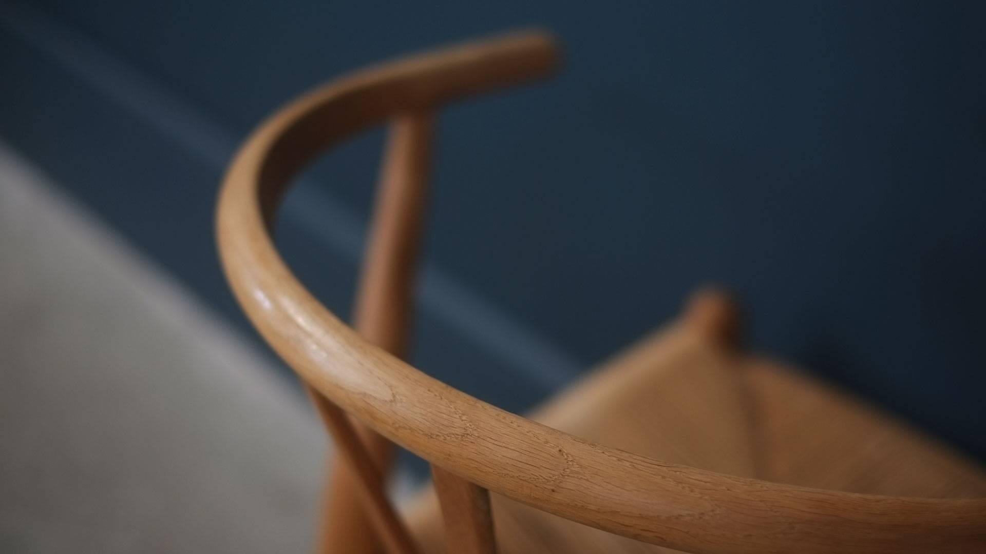 Beautiful set of vintage Wishbone dining chairs in solid oak and paper cord. Designed by Hans Wegner for Carl Hansen, Denmark, these examples with a wonderful warm patina.