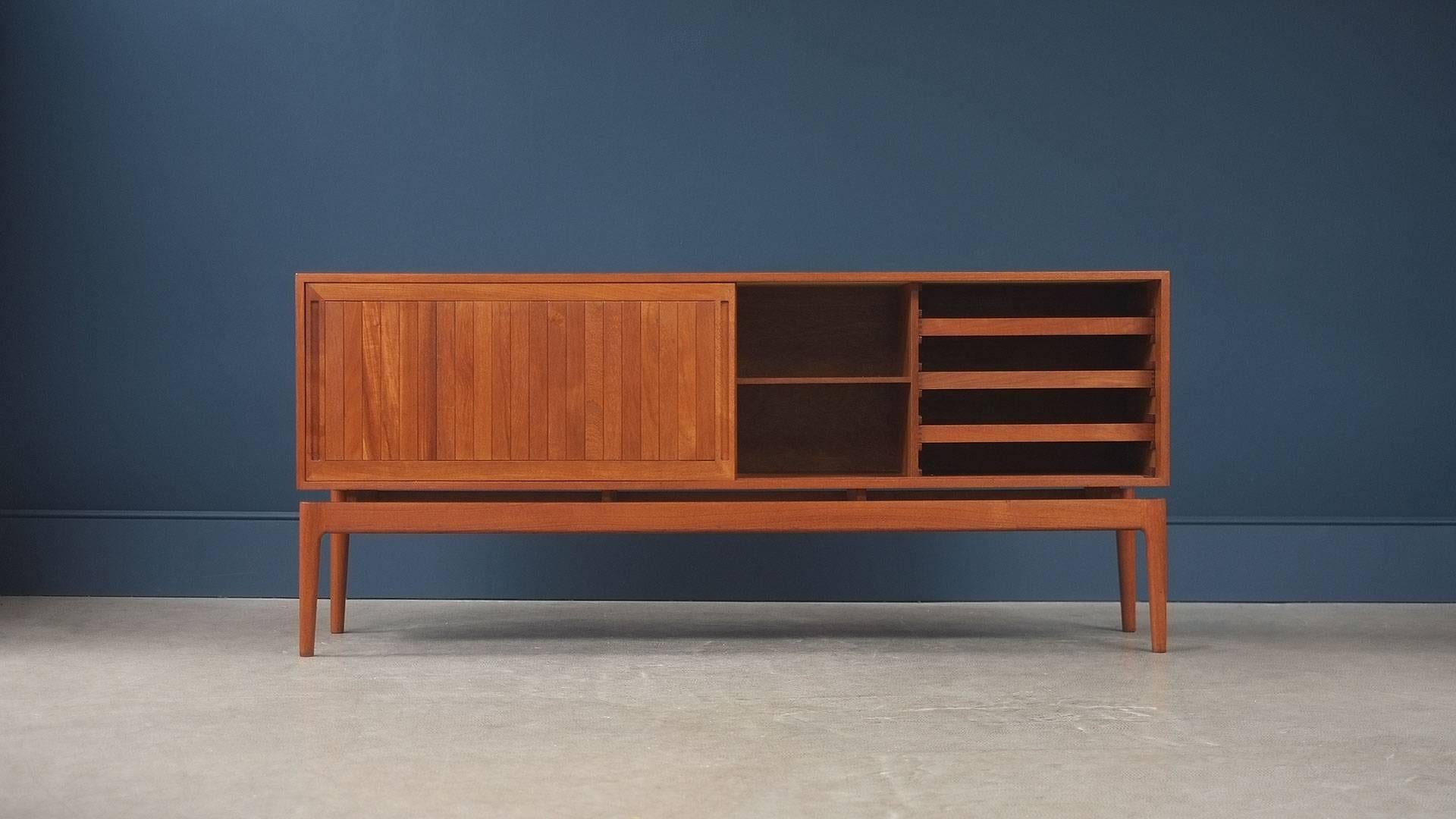 Ultra elegant sideboard in teak with wonderful proportions and fantastic detailing by as yet unknown designer, Denmark, circa 1960. Amazing quality.