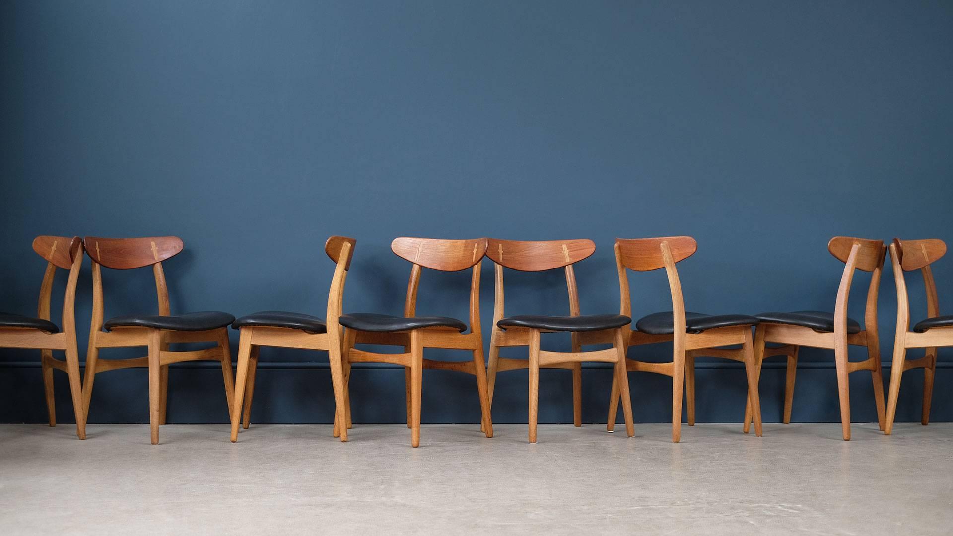 Wonderful set of eight CH30 chairs designed by Hans Wegner for Carl Hansen, Denmark. These examples in oak with contrasting teak back rail and new analine leather. Fantastic exposed joint detail.
 