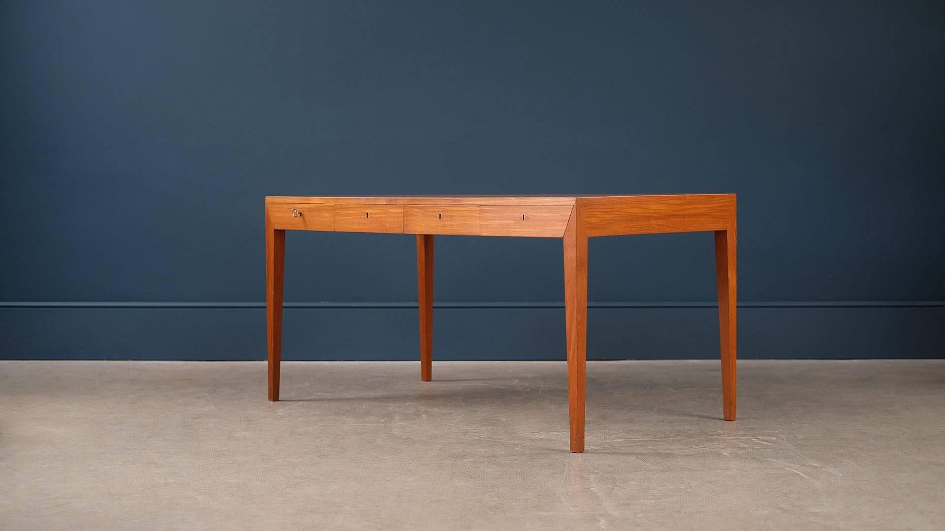Super sought after desk designed by Severin Hansen for Haslev, Denmark. The most elegant Danish desk of the period with wonderful details. This example in teak with beautiful grain. Great piece.

 