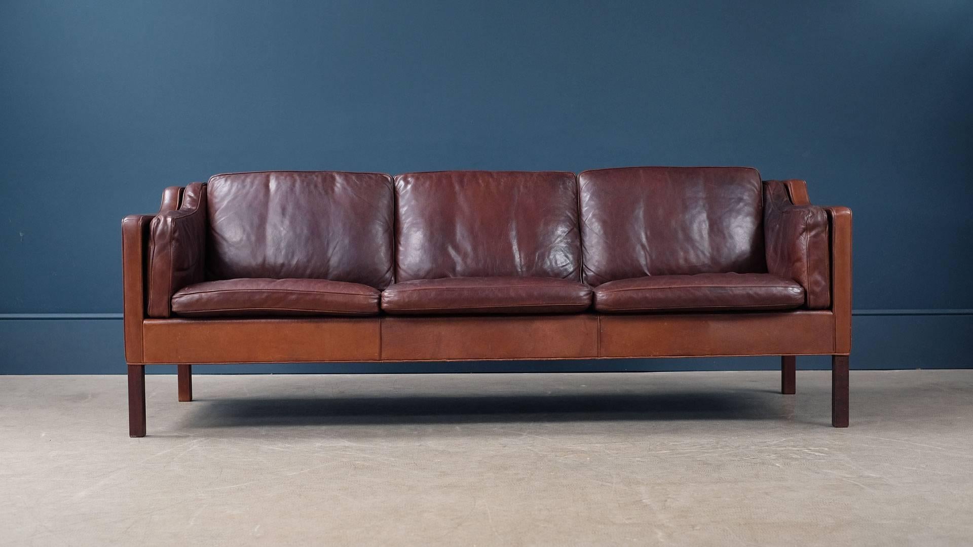 The real thing Fantastic early example of the classic three-seat sofa designed by Borge Mogensen for Fredericia, Denmark model 2213. This example in wonderful and super rare thick brown analine leather with perfect patina. Amazing to see in this