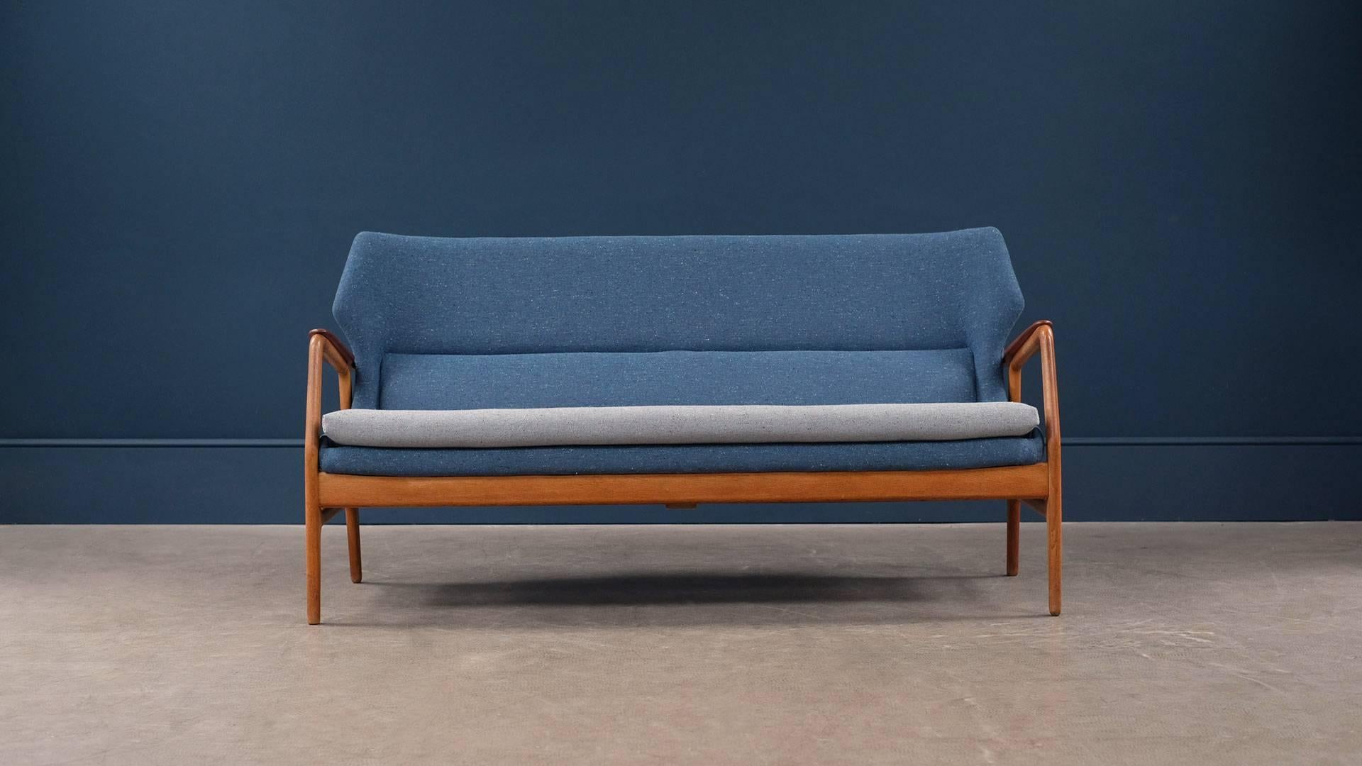 Sofa in solid oak with contrasting teak arms and back rail, designed by Aksel Bender Madsen for Bovenkamp. Fully reconditioned with new blue / grey upholstery.
 