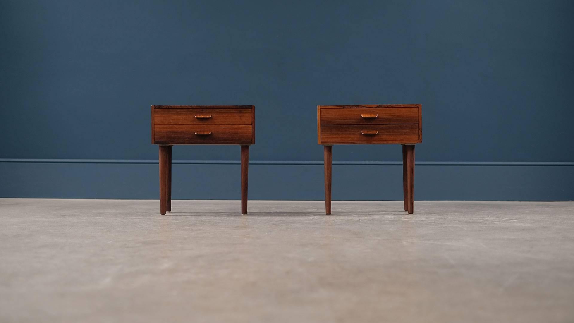 Amazing and so rare to find a pair of Danish bedside cabinets in superb quality figured rosewood. Very elegant proportions and ultra fine details. Wonderful pair.