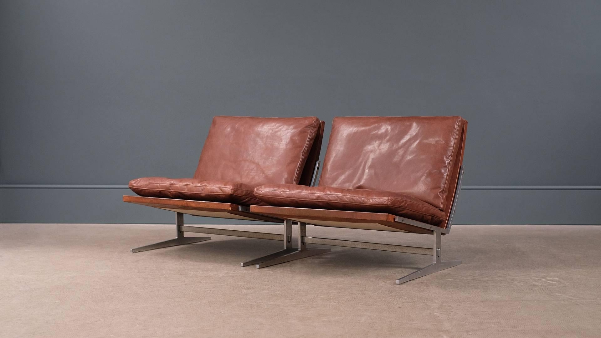 Amazing pair of BO 561 lounge chairs in superb chestnut brown leather designed by architects Jørgen Kastholm & Preben Fabricius for Bo Ex, 1962, Denmark. Original leather frames with fabulous patina and new ultra high quality matching leather