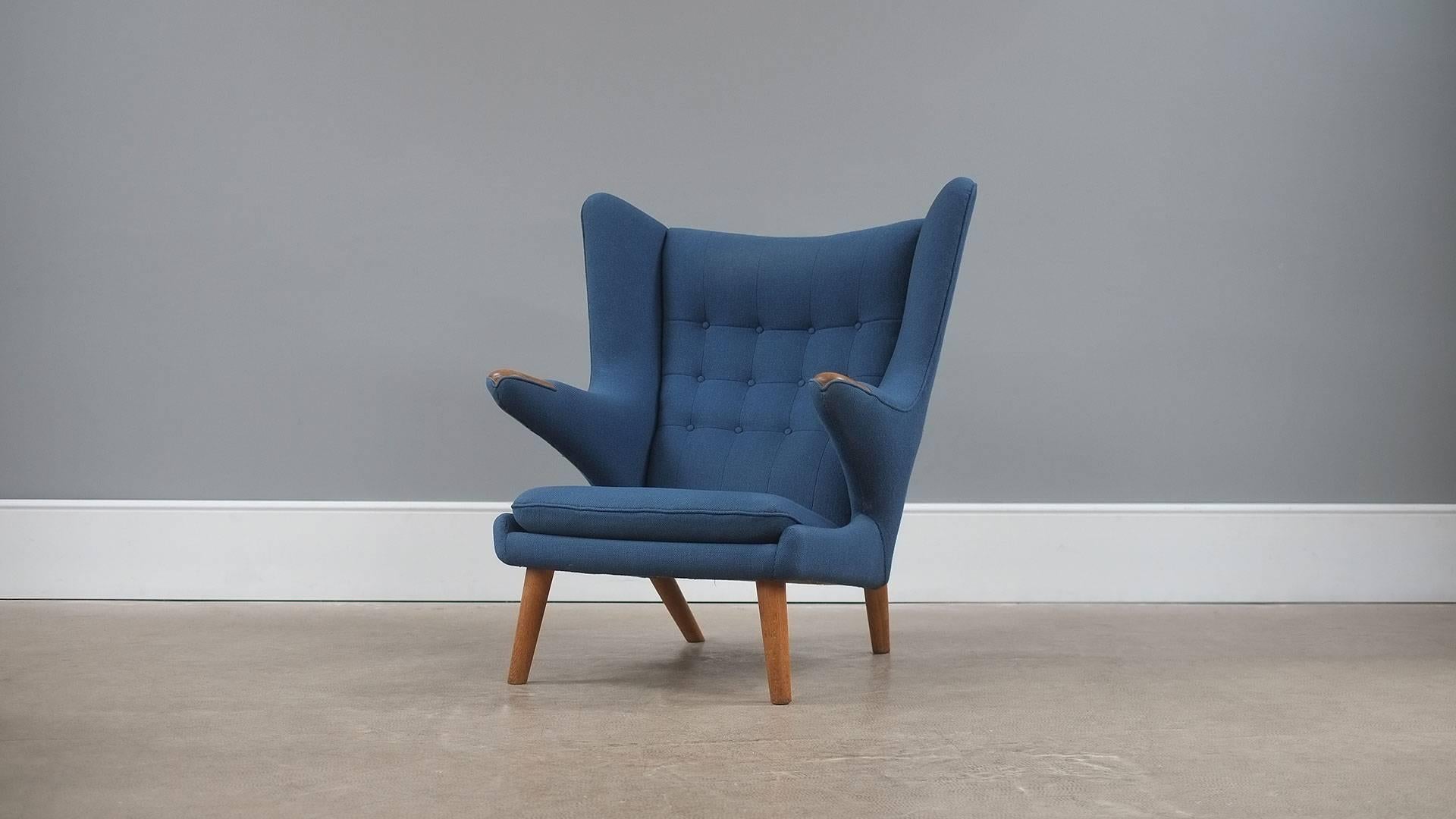 Wonderful original Papa Bear chair designed by Hans Wegner for AP Stolen, Denmark. Very beautiful example with blue Kvadrat fabric and oak legs and ‘paws’.