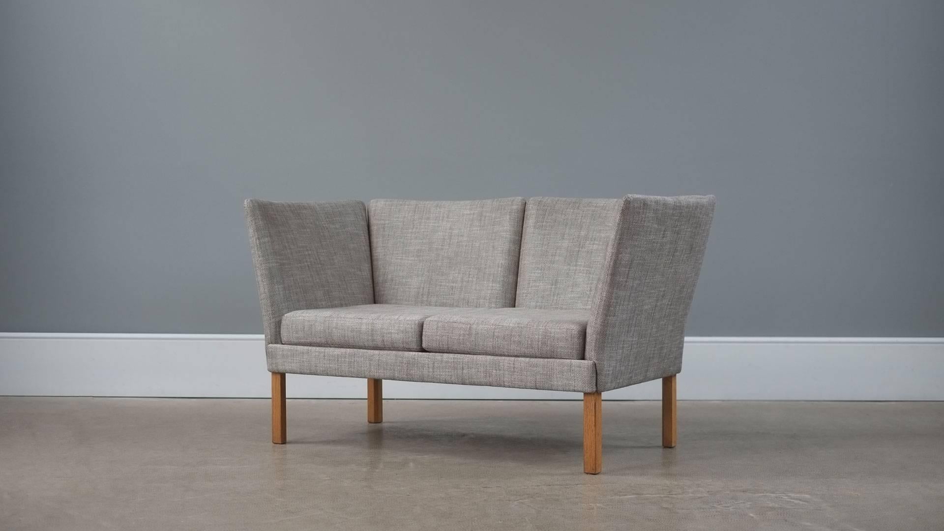 Beautiful Danish two seat sofa by Erik Jorgensen. Fully reconditioned and reupholstered in Romo Delano fabric. Lovely sofa.
