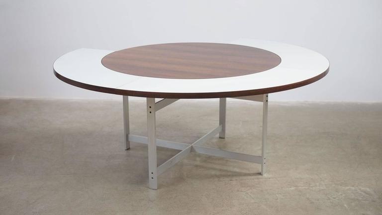 Very rare and beautiful dining table in rosewood with white melamine leaves and sculptural matte chromed steel base designed by Jorgen Hoj for Niels Vitsøe 1963, Denmark. Seldom seen piece of great Danish design.