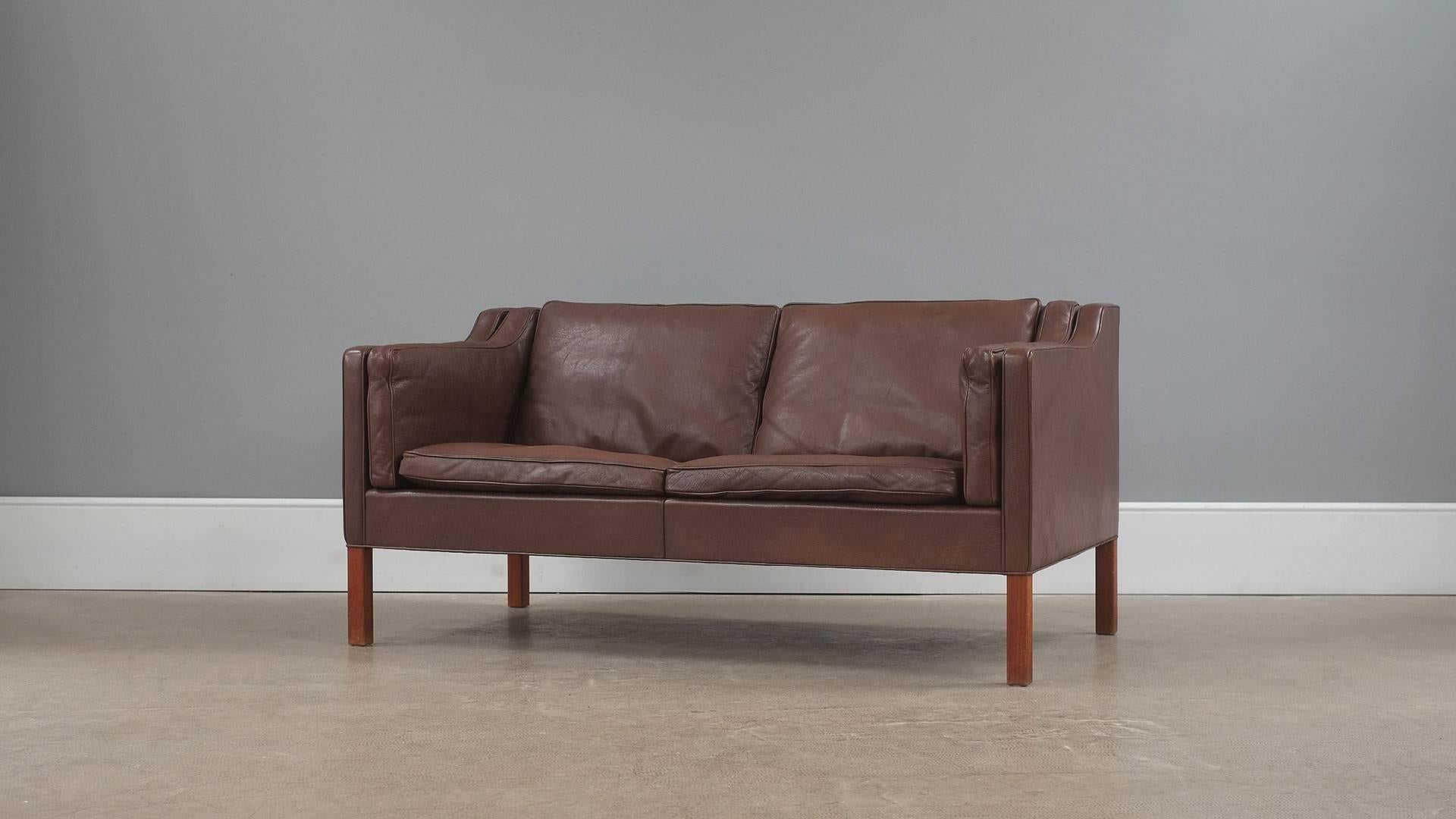 The real thing… Fantastic example of the classic 2 seat sofa designed by Borge Mogensen for Fredericia, Denmark model 2212. Unsurpassed quality and in beautiful brown leather with solid teak legs. Wonderful sofa.