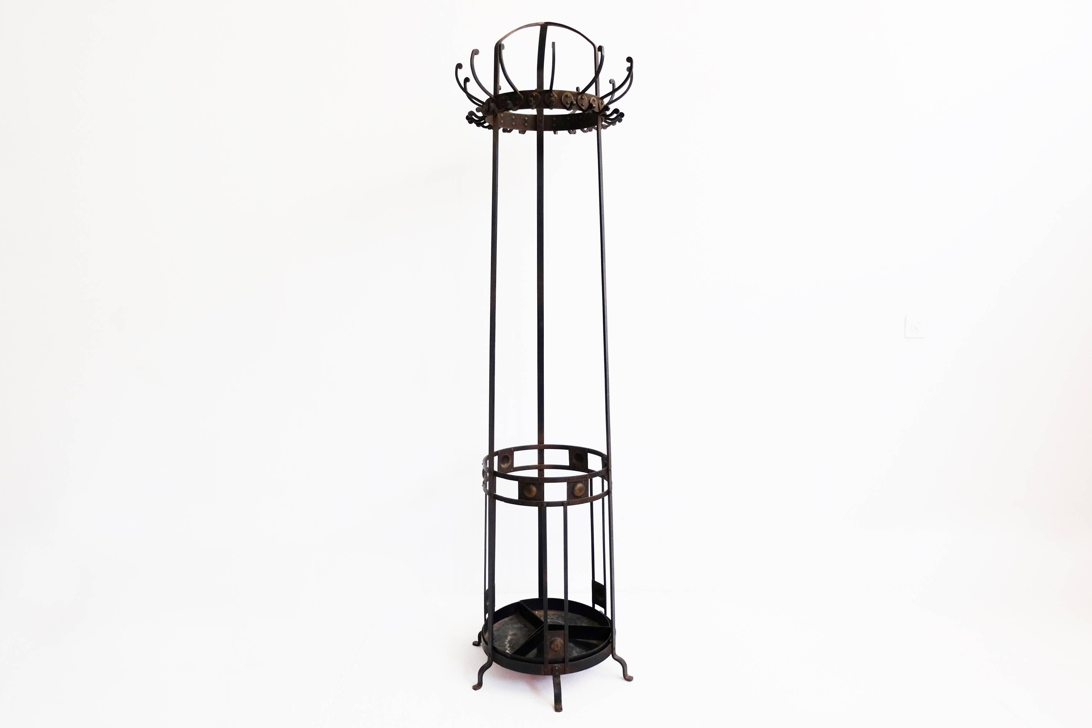 Coat rack and umbrella stand In hand-wrought iron of the early 20th century.