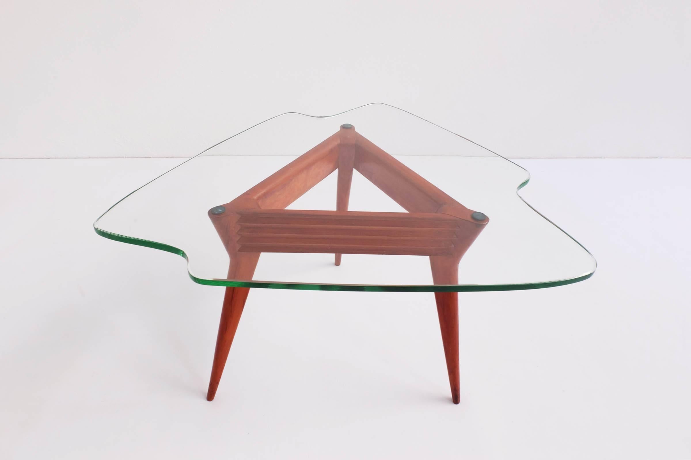 Sculptural coffee table with beautiful irregular shaped glass top.
 