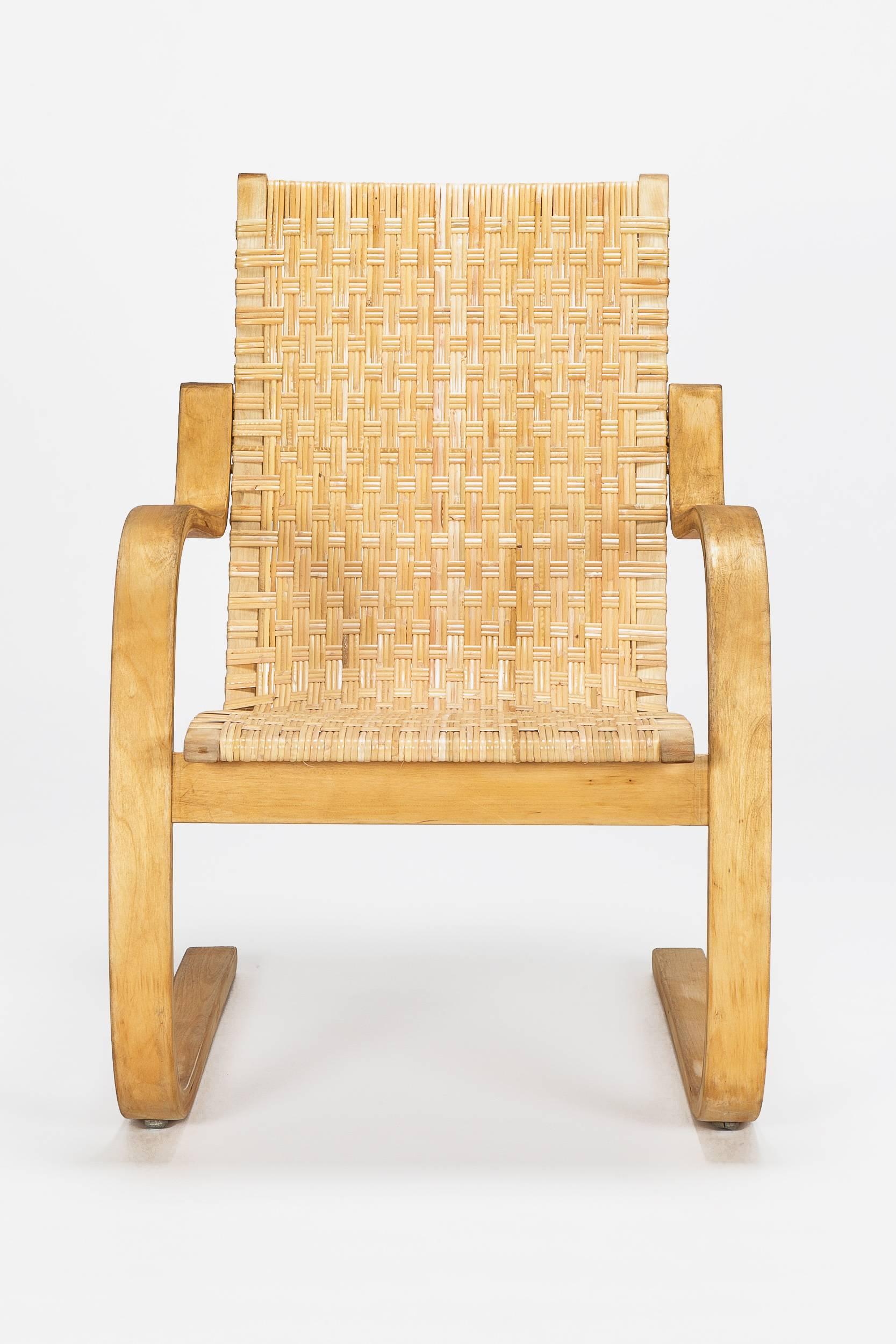 A stunning Alvar Aalto cantilever chair, model 406 designed in 1939 and manufactured by Artek in Finland in the late 1960s. Birch plywood frame with a cane webbing which was completely restored, in perfect condition!