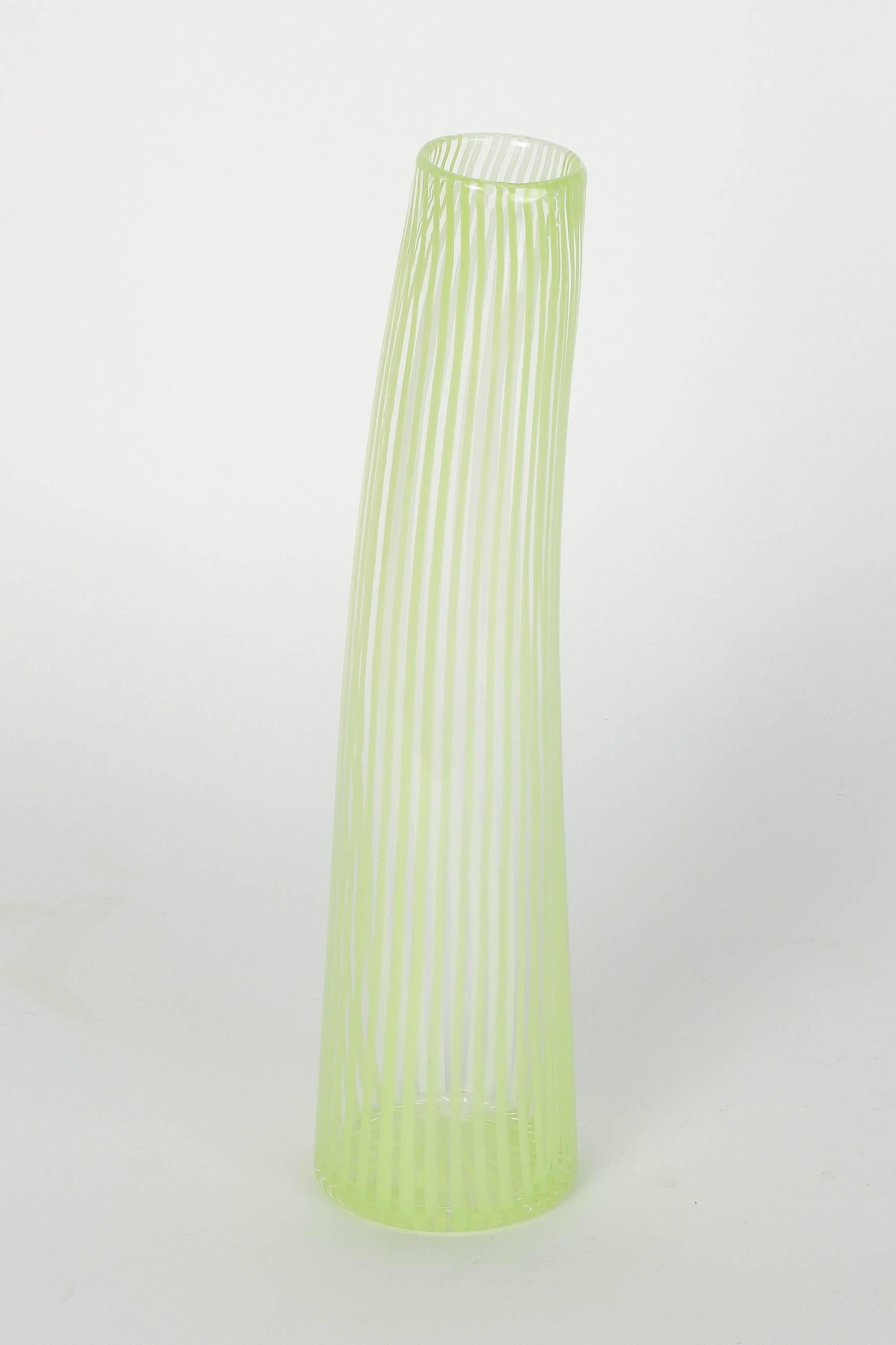 Wonderful Dino Martens filigrana vase with fine yellowish green and white stripes. Slightly curved, polished pontil mark. Not signed.
Height: 31.5 cm.
Diameter base: 7.5 cm.
Diameter opening: 4.5 cm.