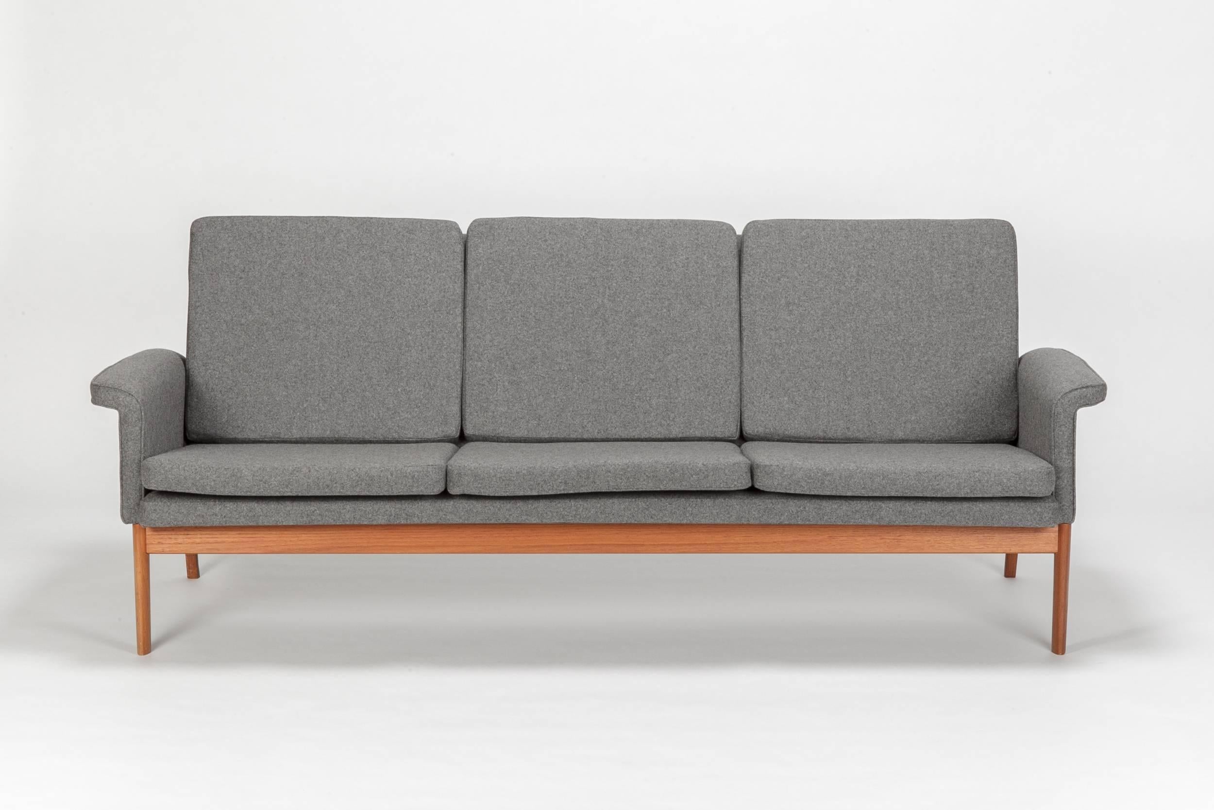 Rare Finn Juhl sofa, model No 218 “Jupiter” for France & Son. Designed in 1965 and manufactured in the late 1960s. The base is made of solid teak, new covered in a fine flannel fabric.