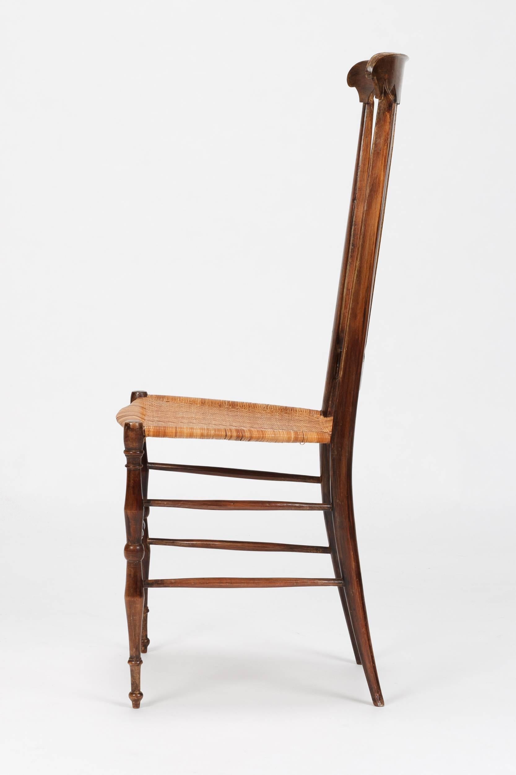 Single side chair from Chiavari in Italy, 1950s. Solid walnut frame with a seat of woven cane. Wonderful handcrafted details.