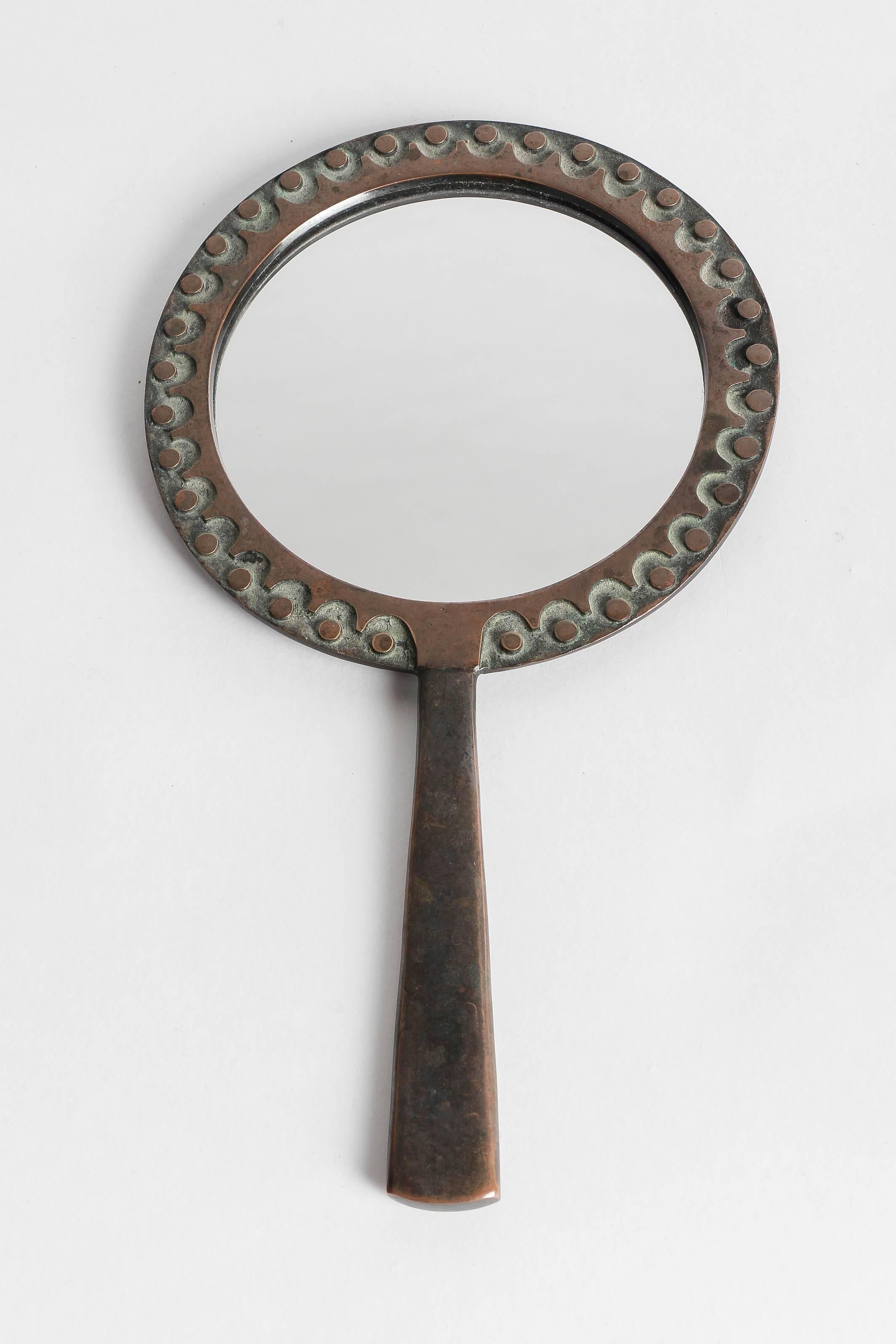 Hand-forged unique piece by the Hungarian sculptor Ottó Kopcsányi in the late 1960s. Hand mirror made of bronze with a lovely pattern, hand-signed on the back by the artist.