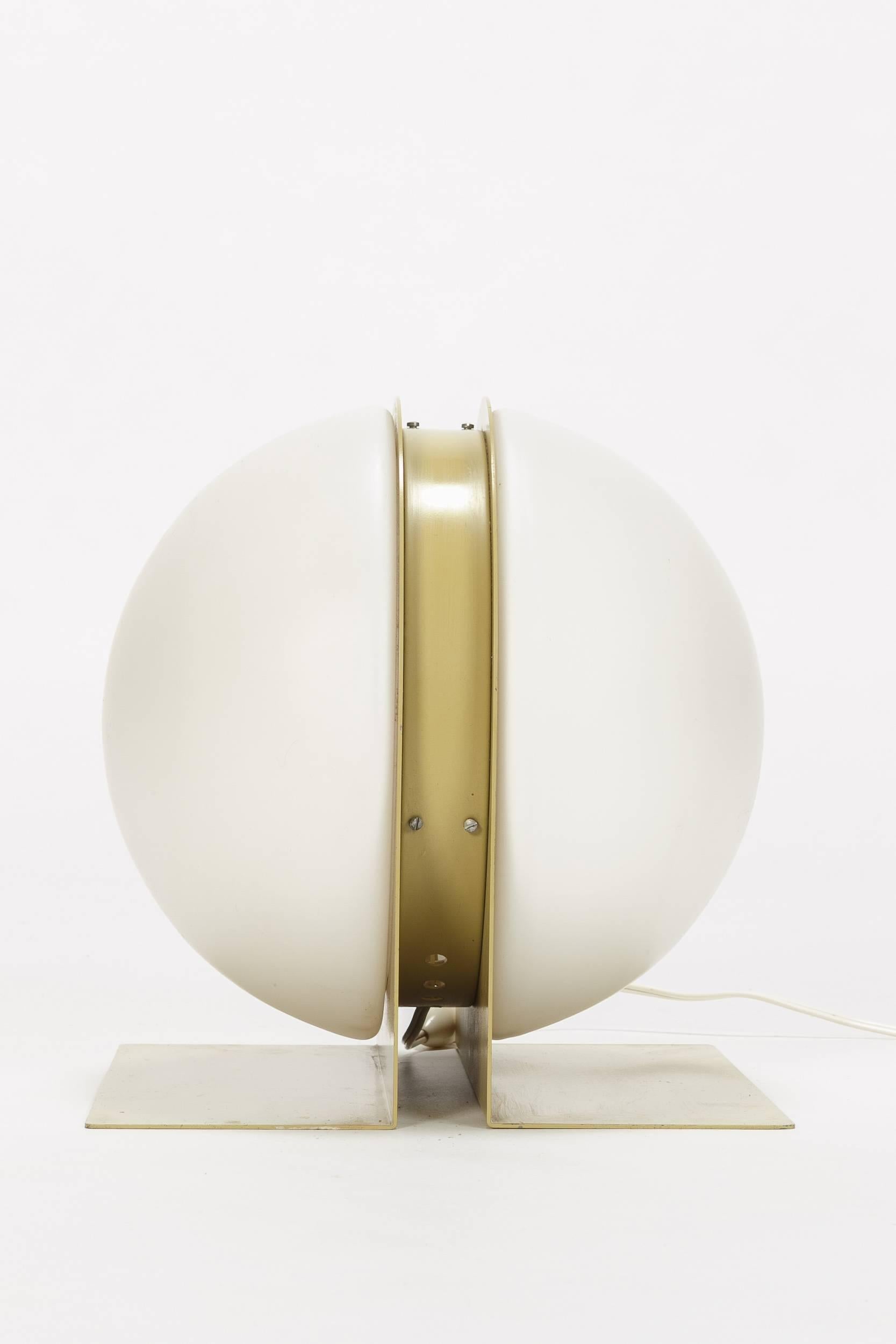 Very rare Ben Swildens table lamp designed for the French manufacturer Verre Lumière in 1970. The offered model 10445 here was designed by artistic director Ben Swildens and is made of satinated opaline glass and lacquered metal. It’s an exemplar