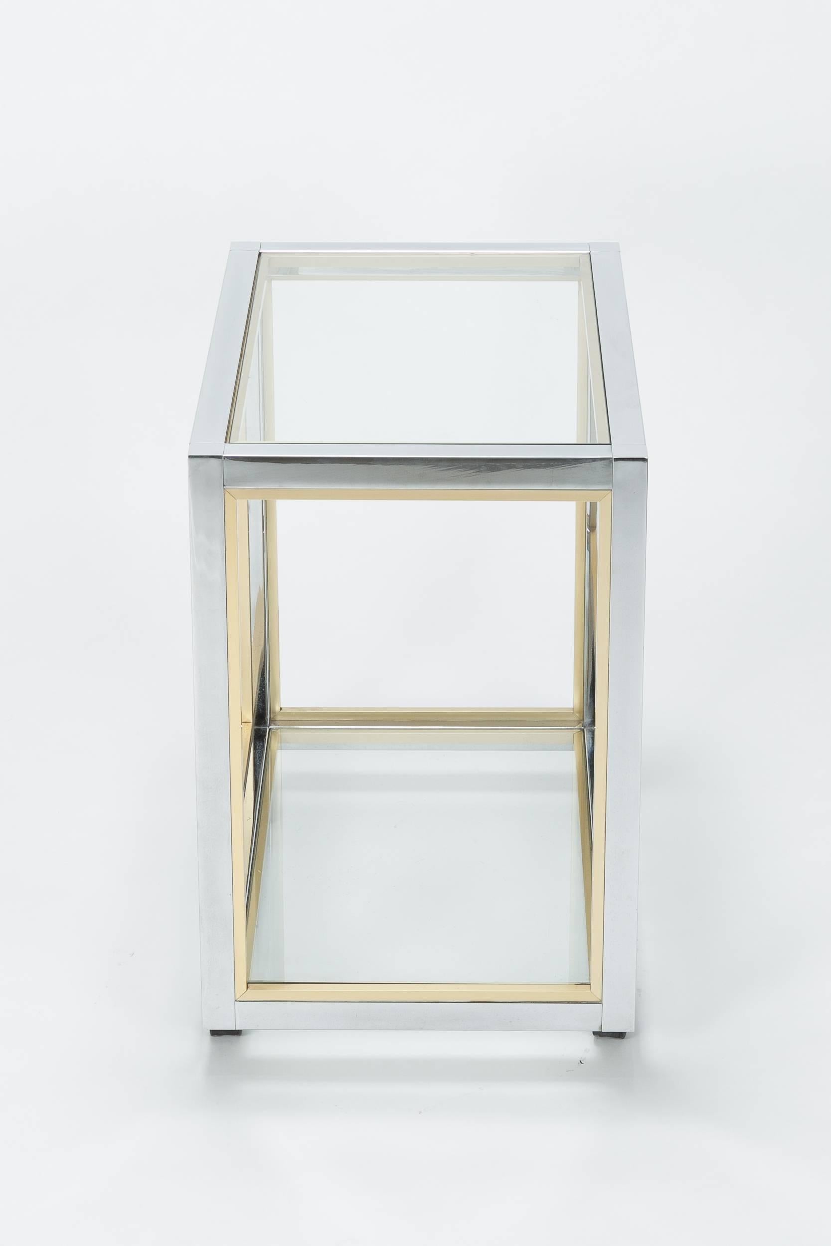 Renato Zevi bar cart designed for his own manufacture Zevi & C. in Italy in the 1970s. High quality craftsmanship made of solid brass and chromed metal, shelves are made of glass. Original manufacturers sticker underneath.
