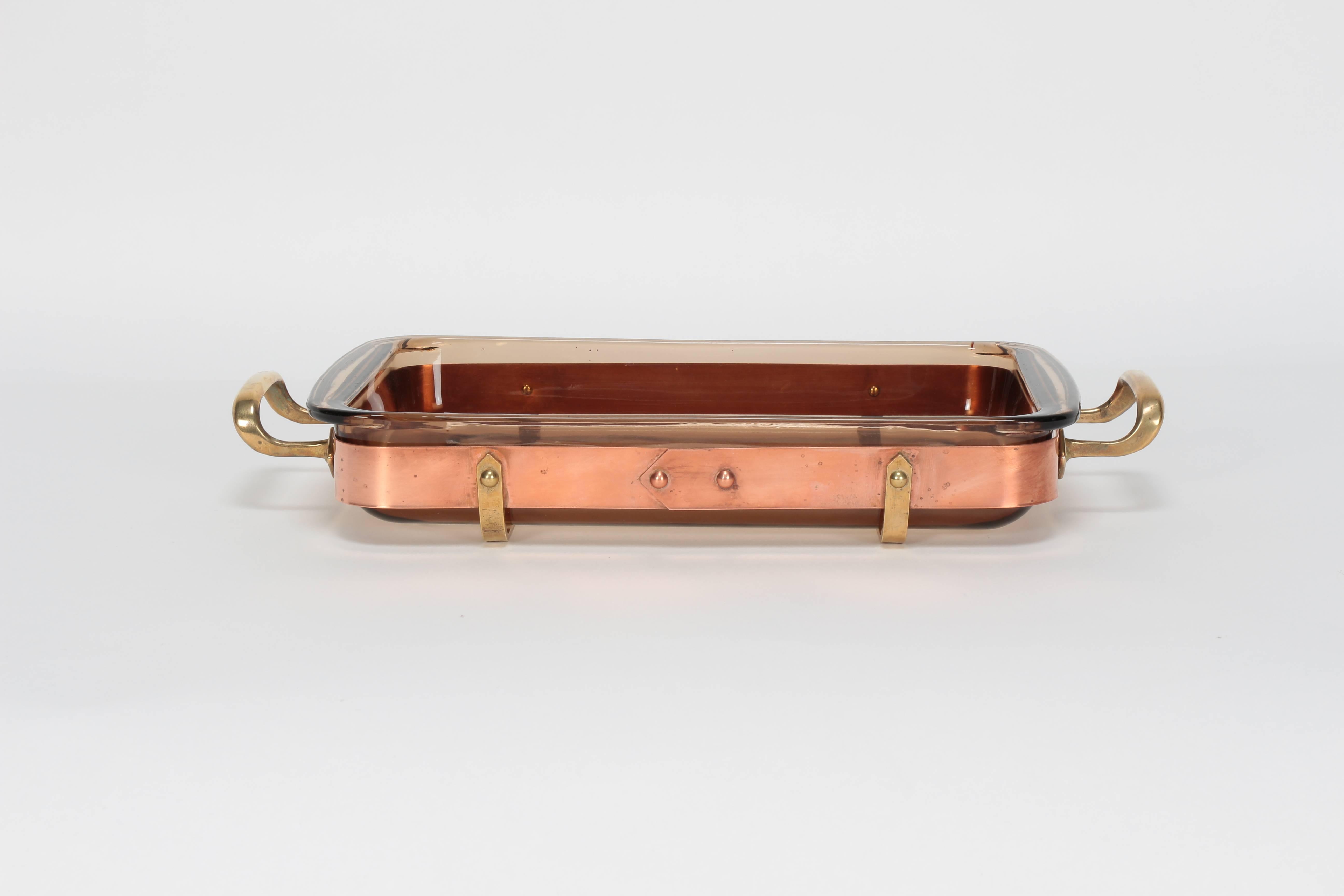 Swedish casserole dish manufactured by Nilsjohan in the 1970s. Beautiful handcrafted copper frame and brass handles. The heat proof glass bowl from Pyrex can contain two litres and is removable.