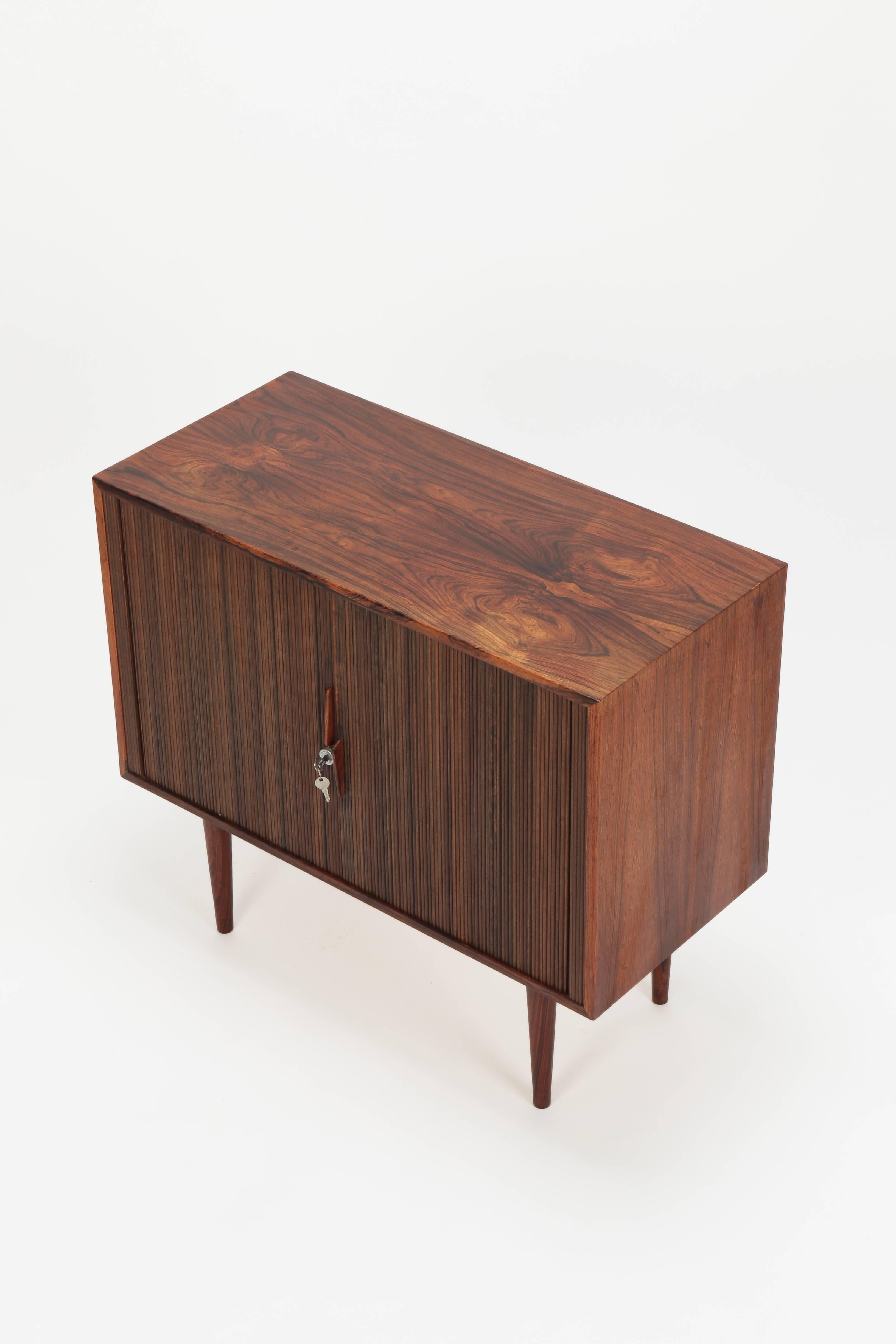 Kai Kristiansen sideboard manufactured by FM Moebler in the 1960s. Small rosewood sideboard with lockable tambour doors, one shelf and two drawers.