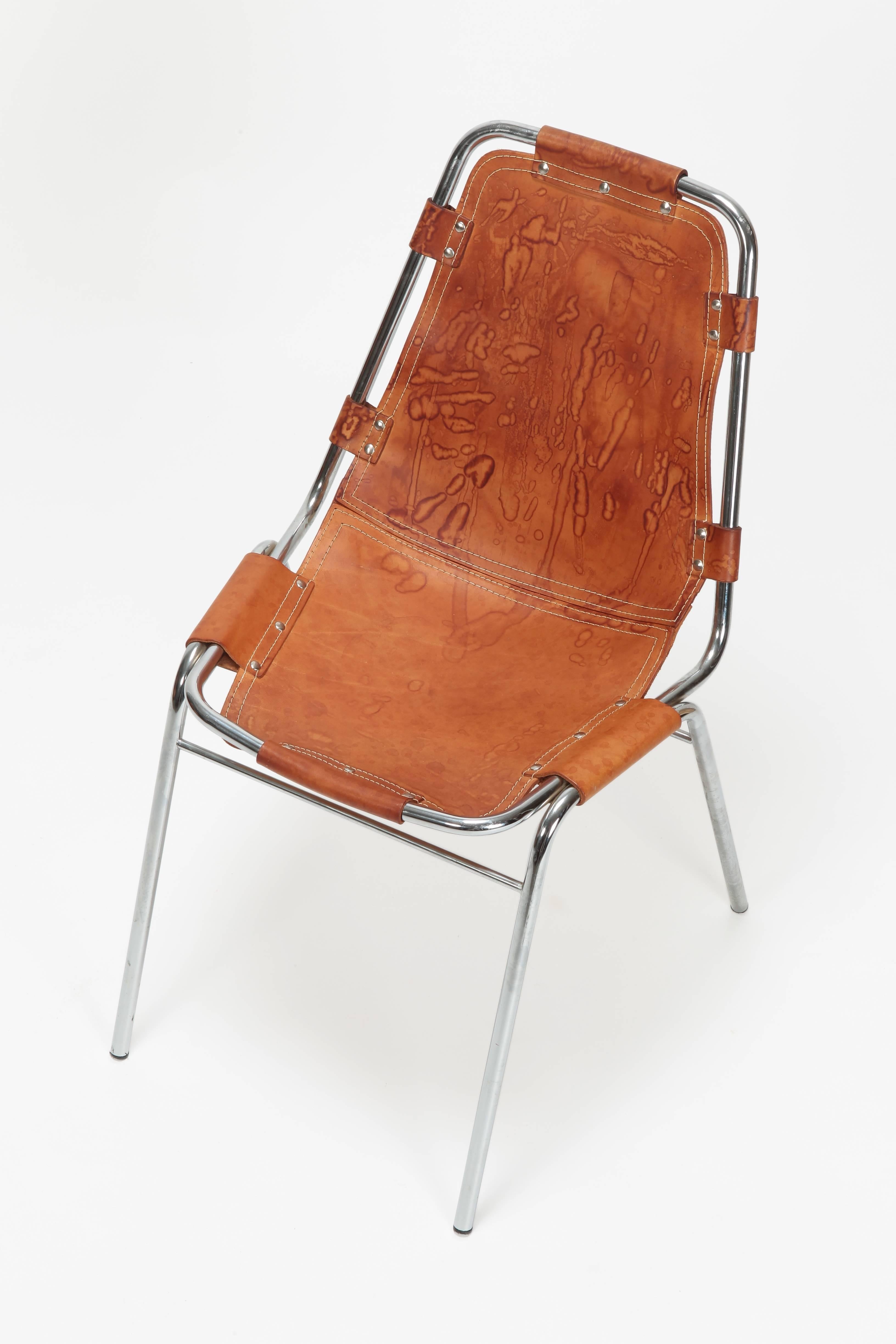 Charlotte Perriand chair Les Arc manufactured by Cassina in den the 1960s. A rare an beautiful leather and chromed tubular chair designed by Charlotte Perrian for the ski resort Les Arc.