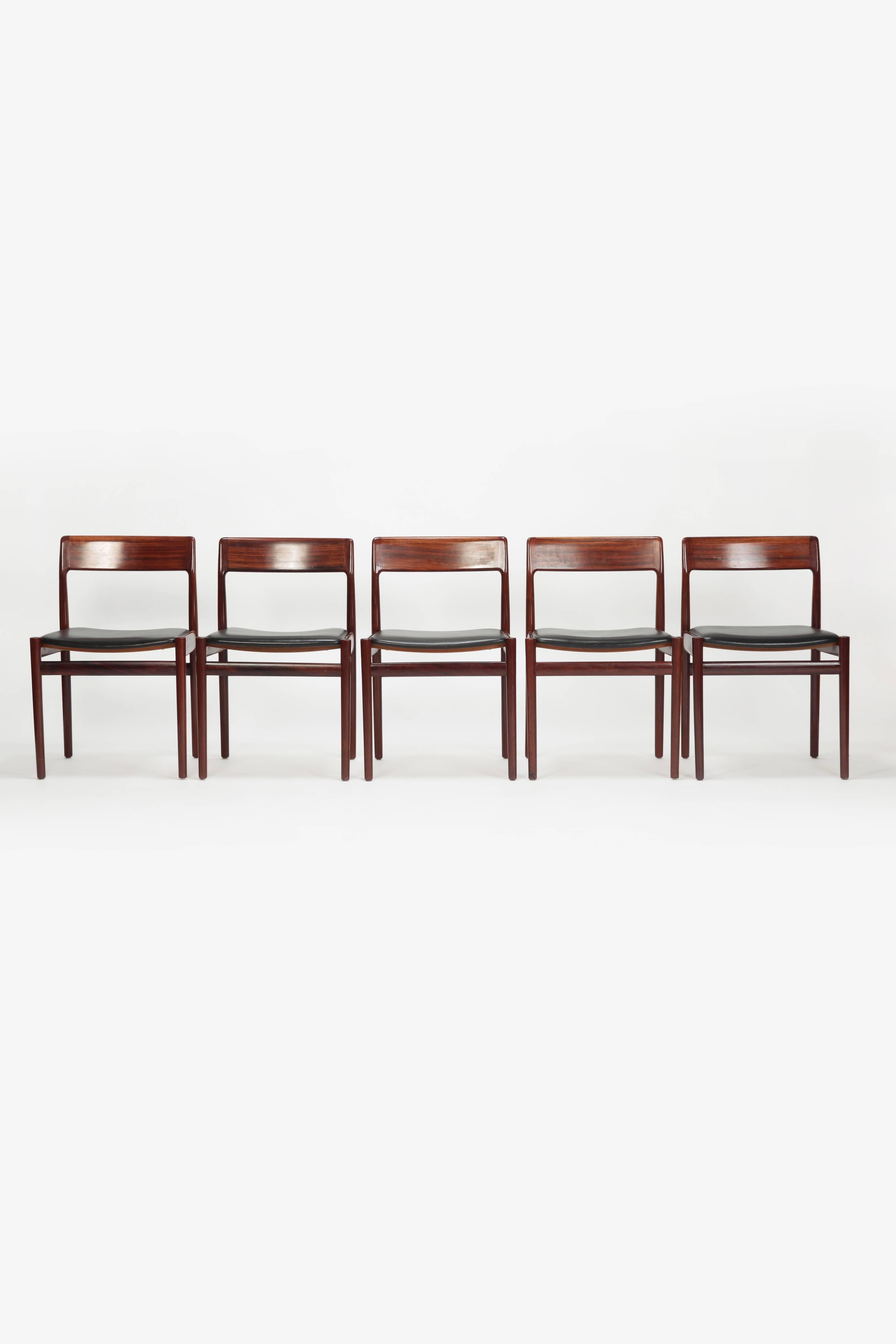 Five Johannes Norgaard chairs manufactured by Norgaards Moebelfabrik in the 1960s. Elegant, simple rosewood and black leather chairs.