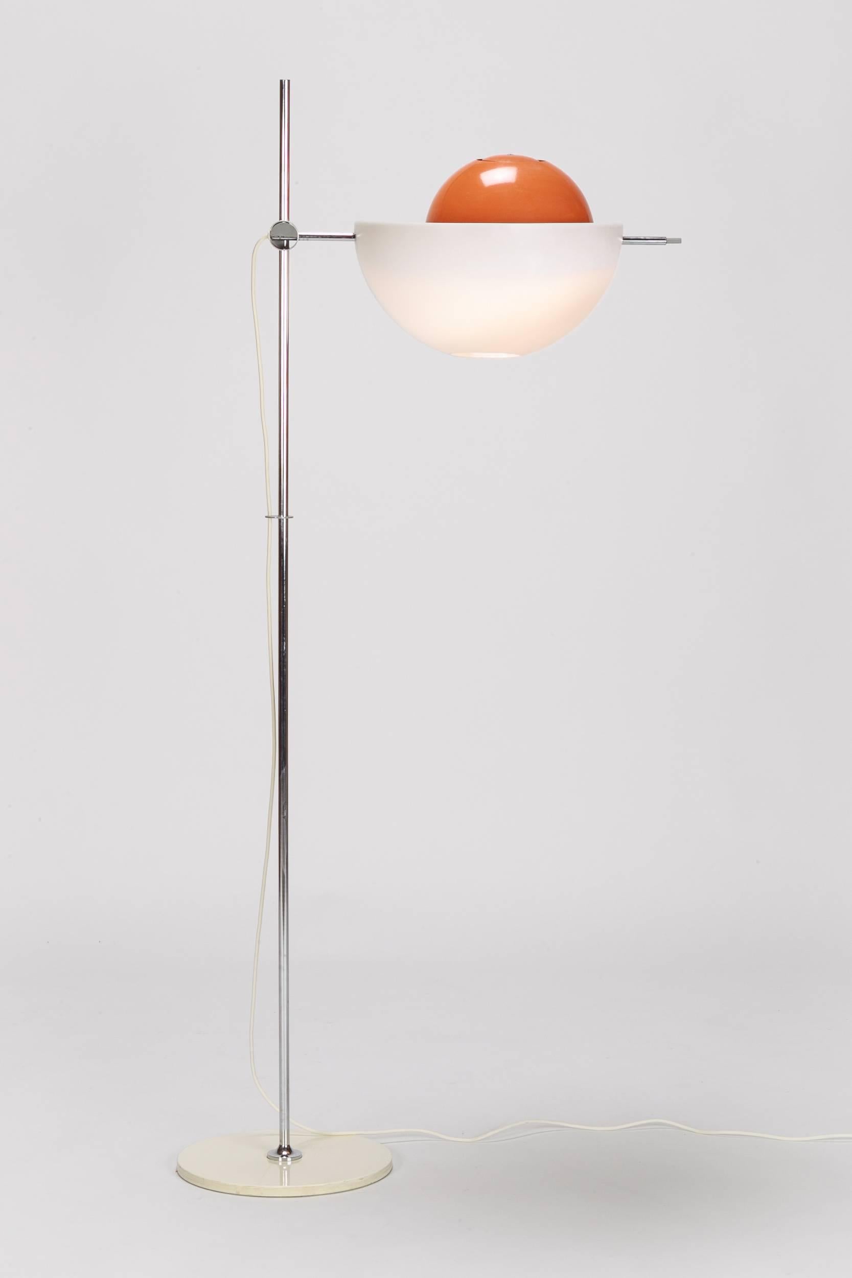 A wonderful and very rare to find floor lamp Type 300, designed by Rico and Rosemarie Baltensweiler, introduced in 1971 by the Baltensweiler manufacture in Switzerland.  This is a rarely seen version with an original orange colored hemishpere which