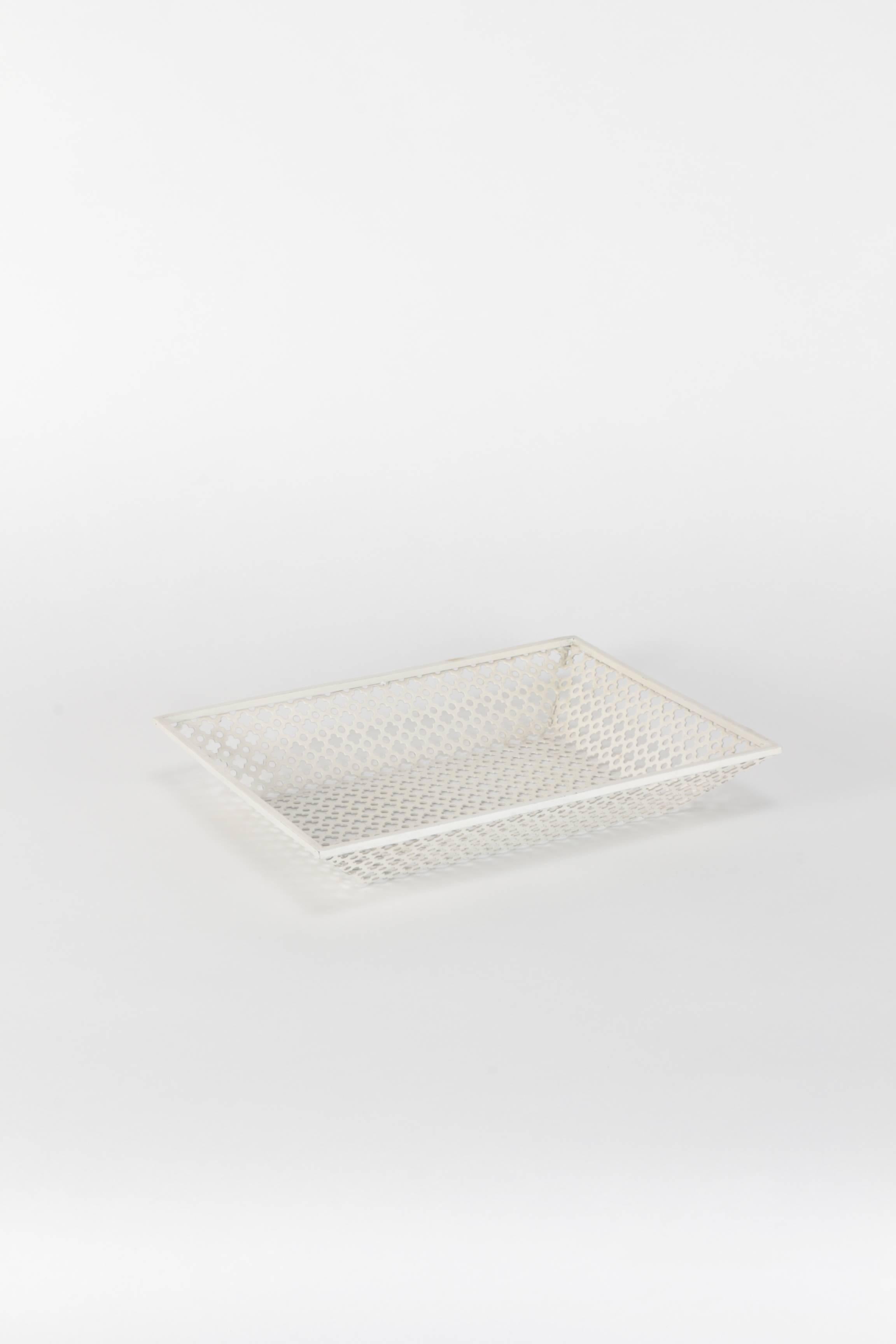 Wonderful and rare perforated metal fruit basket by Mathieu Matégot, manufactured in the Matégot workshop in France in the 1950s.