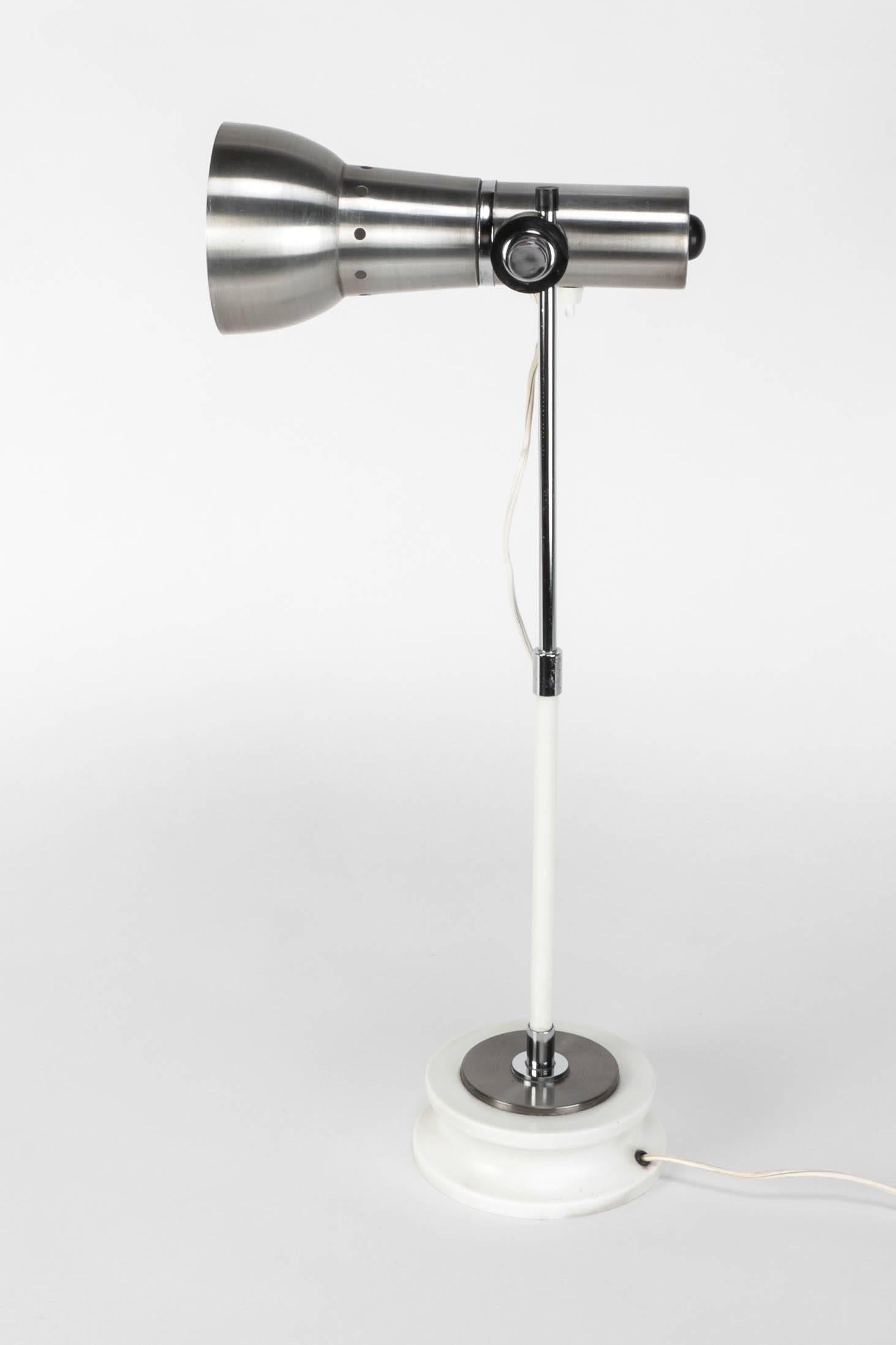 Lovely Italian table lamp by Stilnovo, 1960's. White lacquered metal base, brushed aluminum shade, shade is adjustable. The switch is located on the shade.