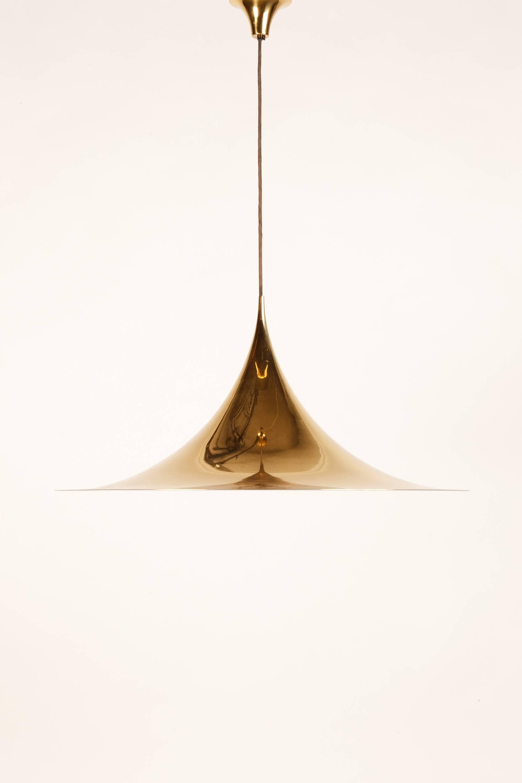 Extra large Semi Pendant lamp by Fog & Mørup, manufactured in Denmark in the 1970's. Here the luxury version in 24ct gold plated metal with a diameter of 70cm! Fabric wire and the original matching canopy.