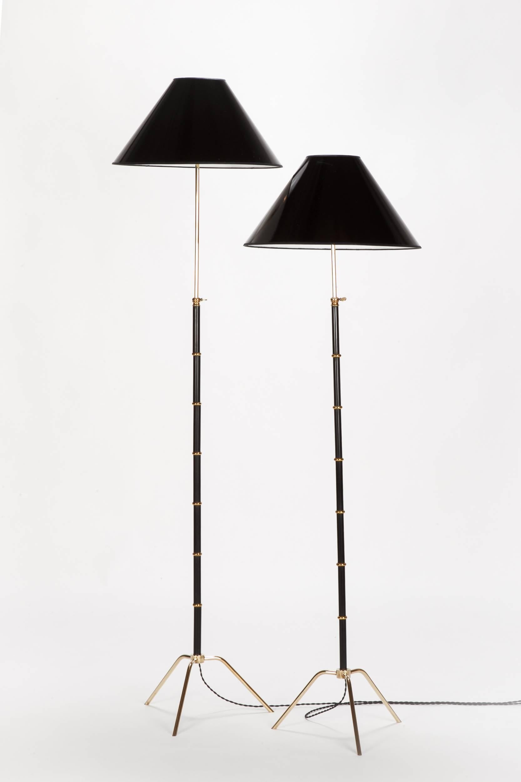 Pair of incredible French floor lamps by Maison Lunel, Paris. Manufactured in the 1950s in a very sophisticated technique with wonderful crafted details. All brass parts are solid. The height is adjustable, the shades are new in the manner of the