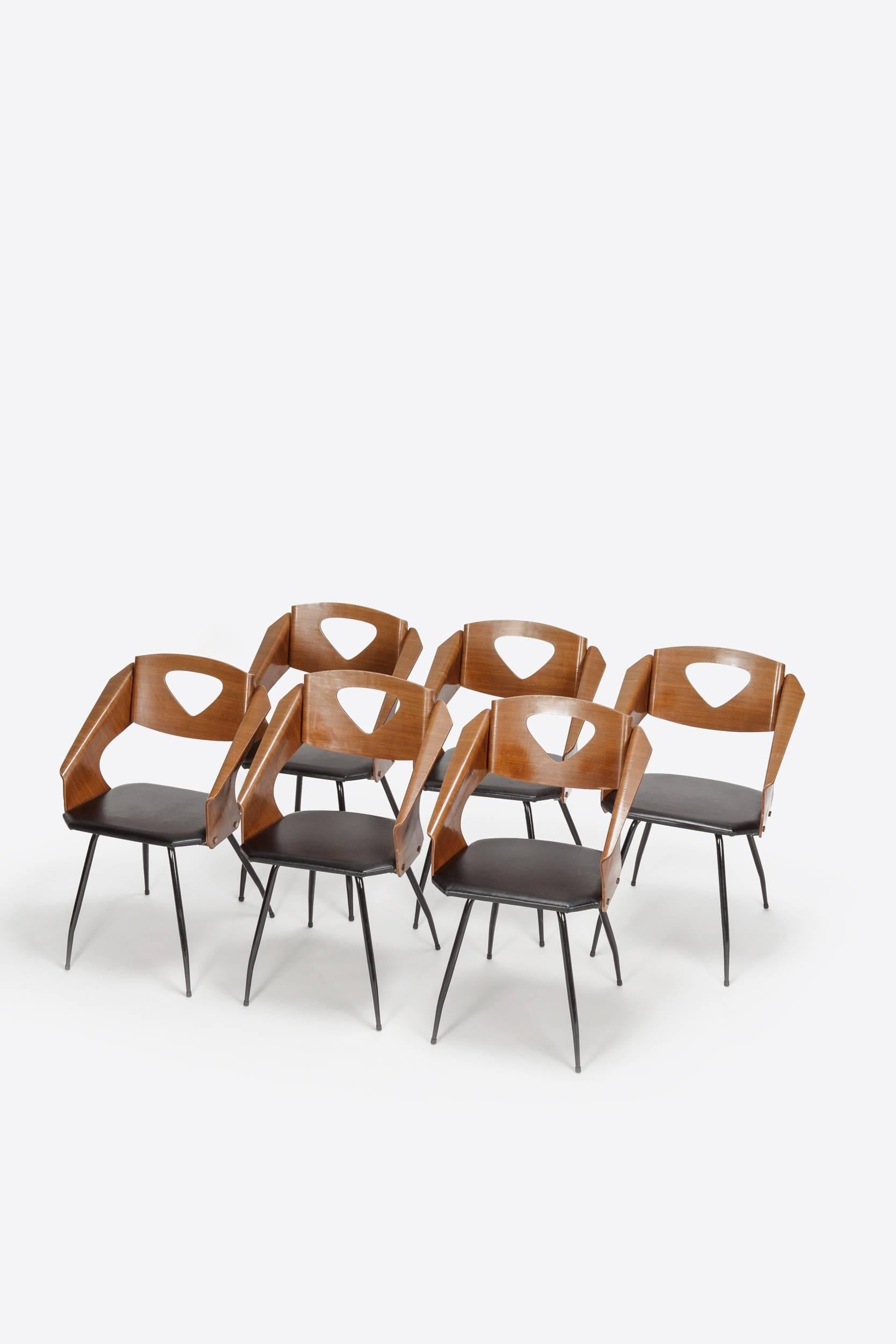Incredible set of six Carlo Ratti chairs manufactured by his company Industria Legni Curva in Lissone, Italy. Moulded mahogany plywood on a black lacquered metal base, the seats were recently new covered with black leather. High-end quality