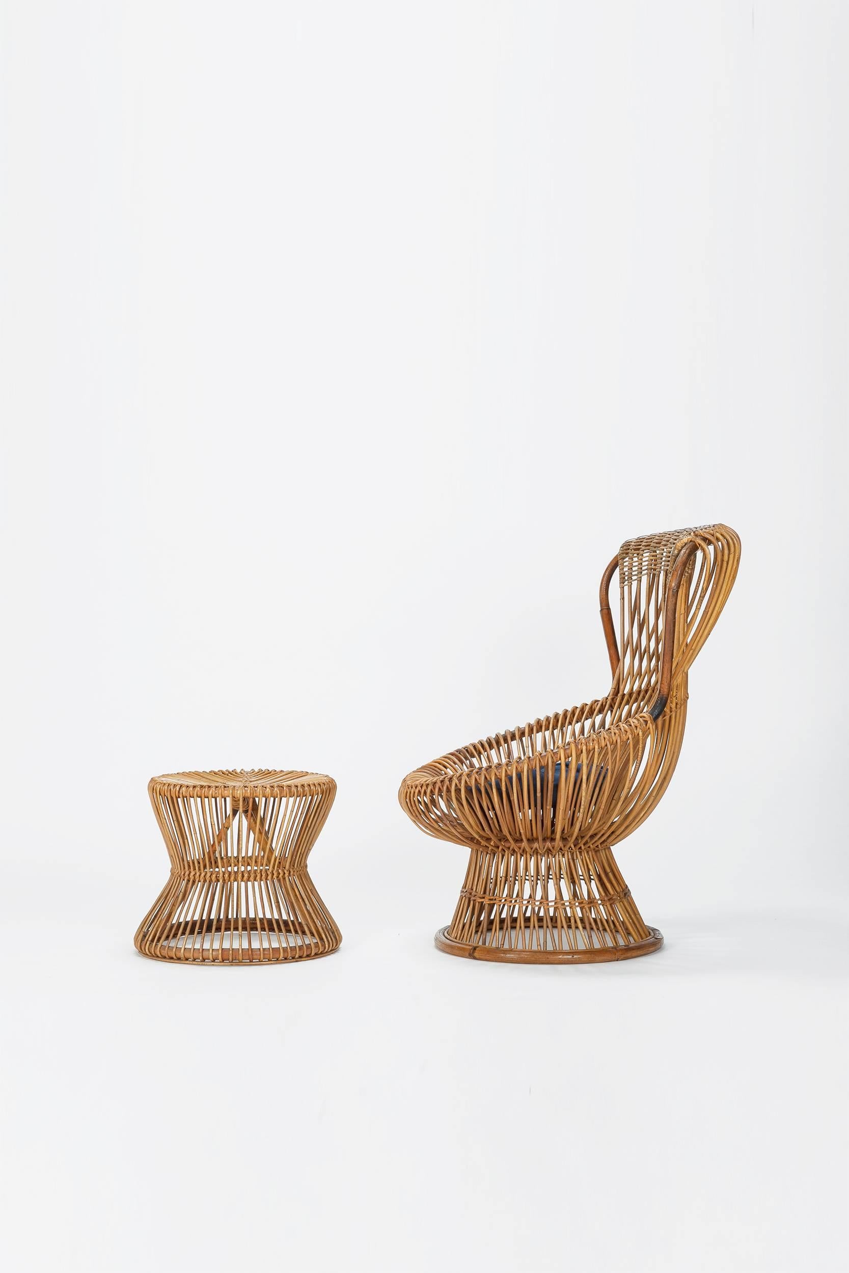 The Franco Albini Margherita chair was designed in Italy in the early 1950s for Bonacina and won the first prize at the 9th Milan Triennale in 1951. The model here was manufactured in the 1950s and has a rare matching side table or stool. The seat