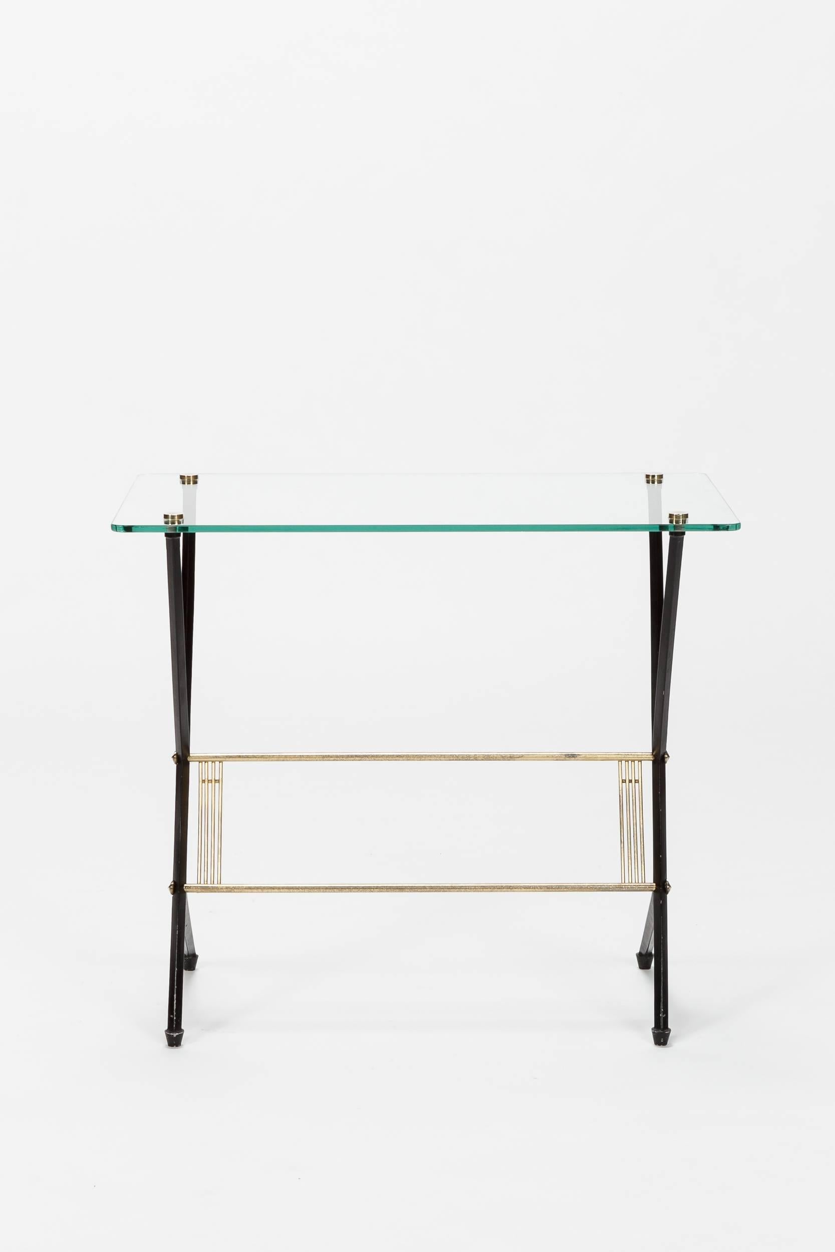 Angelo Ostuni side table manufactured in the 1950s in Italy by Frangi Milano. Crystal glass top, fixed with brass screws. Beautiful shape with wonderful details.