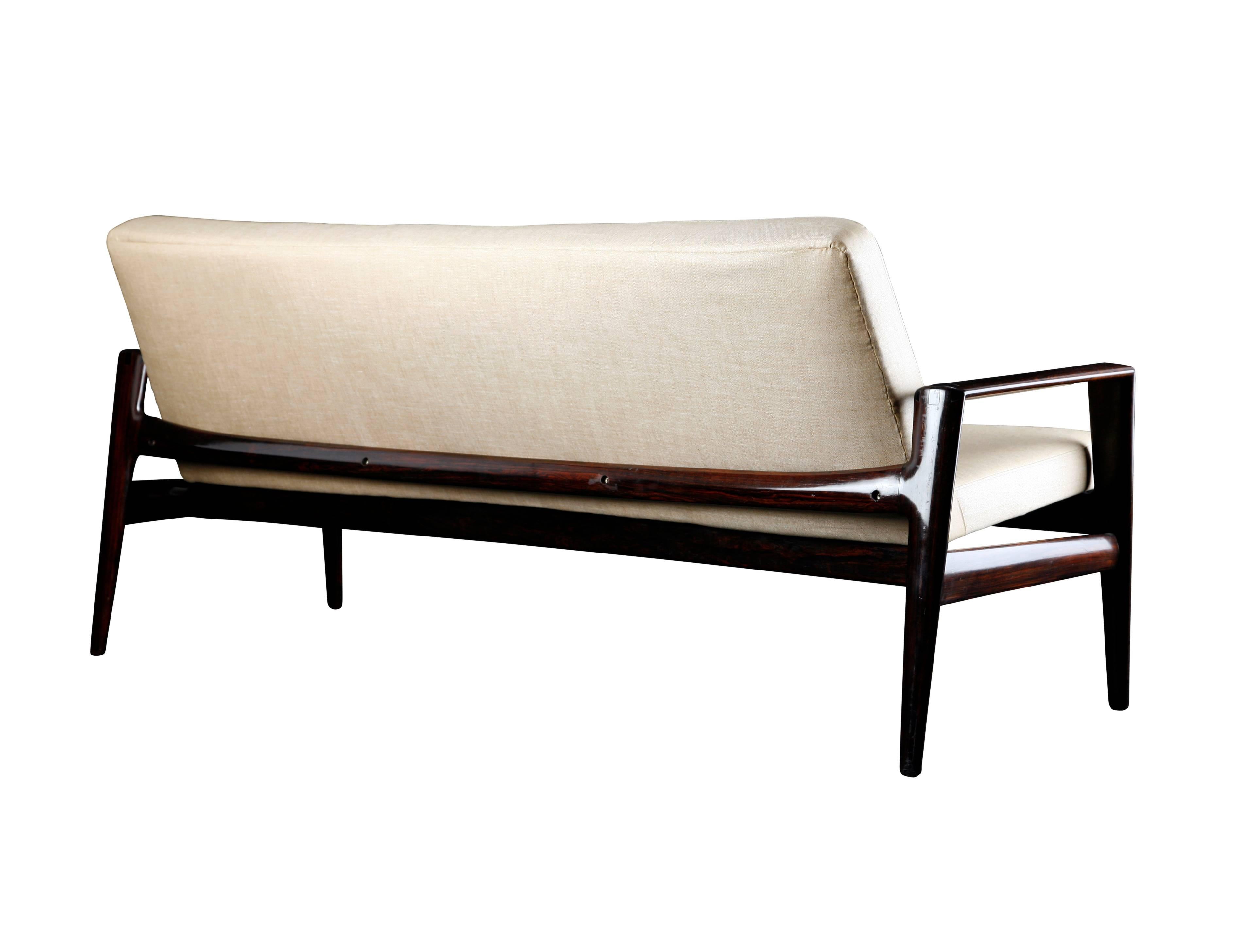 Stunning Italian sofa manufactured in the 1950s in Italy and attributed to Ico & Luisa Parisi. Frame made of solid rosewood, very elegant shape. New cover made of linen fabrics. Beautiful workmanship and very high quality!