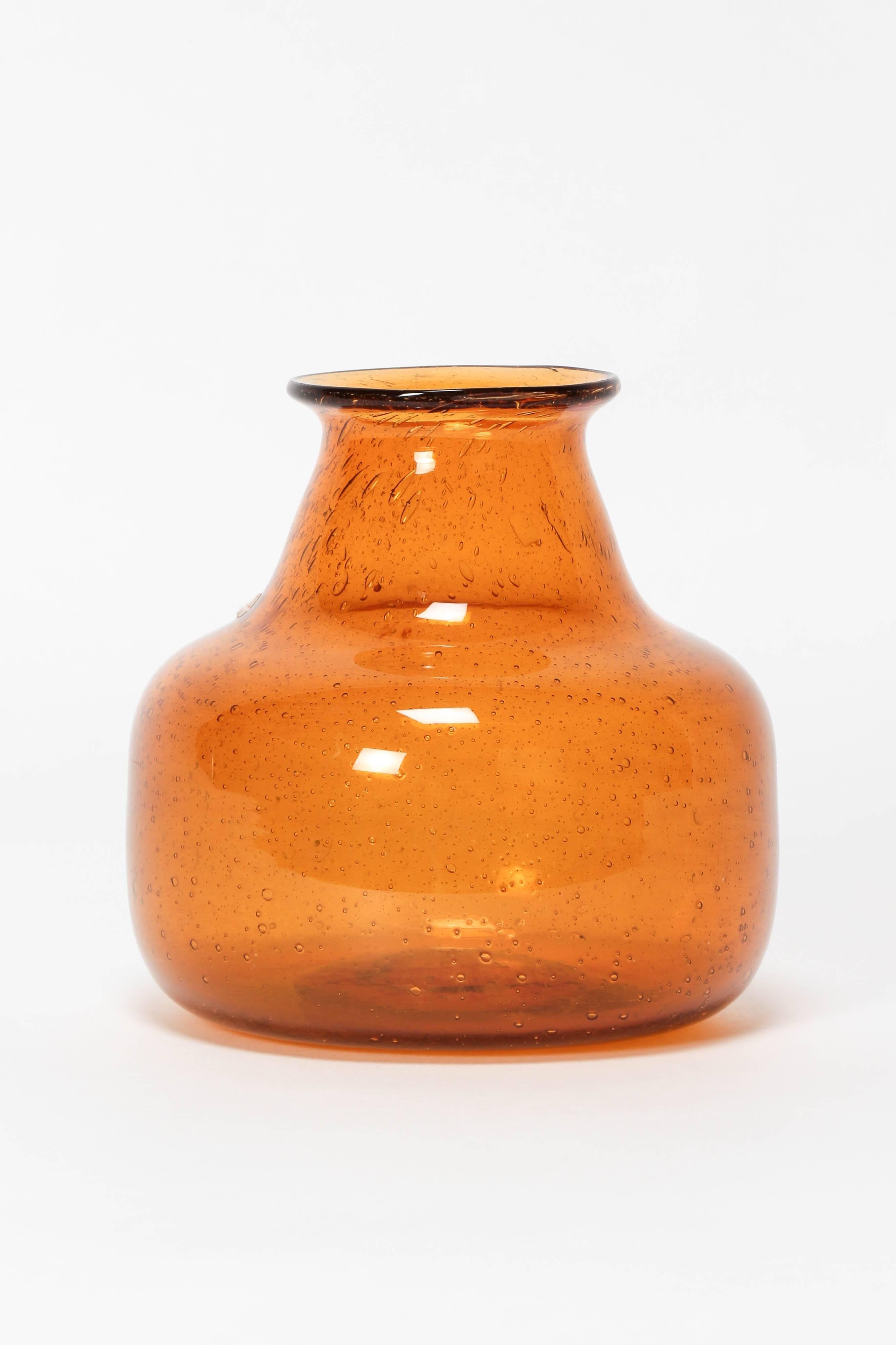 Erik Höglund vase Amber manufactured by Boda in Sweden in the 1960s. Beautiful handblown glass with air inclusions. Comes with tag of the manufacturer and the designer.