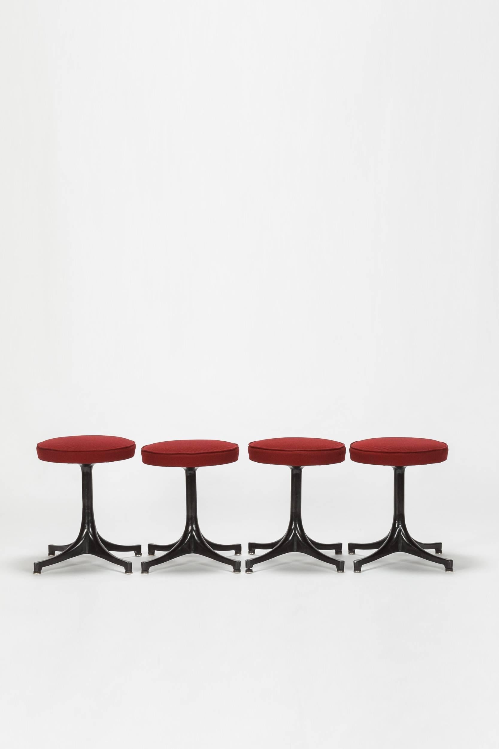 Four George Nelson stool manufactured by Herman Miller in the 1950s. Black sculptural base made of aluminium cast and dark red hopsack cover.

 