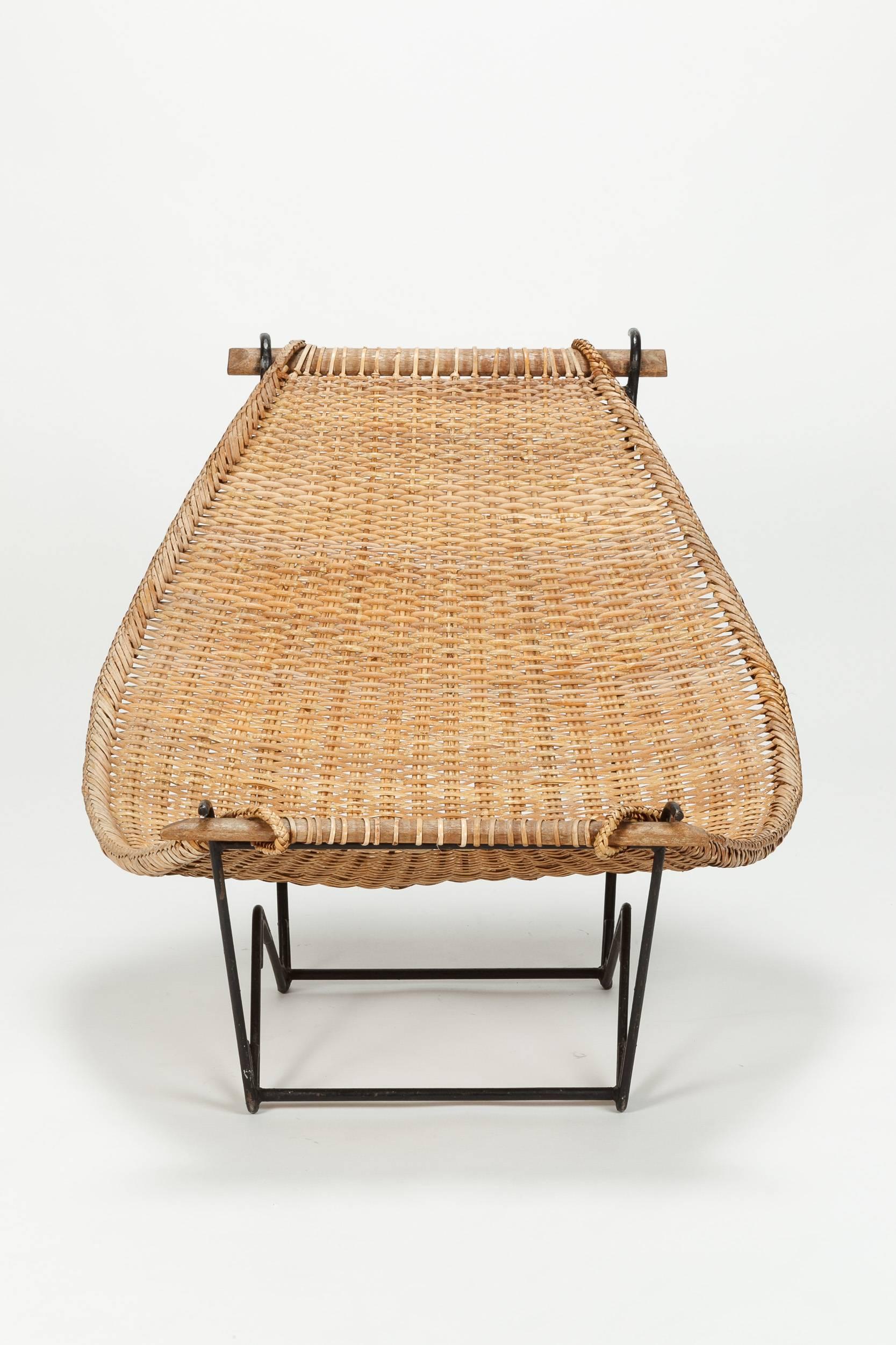 John Risley lounge chair 'Duyan' manufactured in the US in the 1950s. Made of rattan, base of metal.