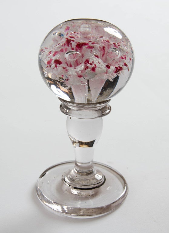 A pair of 19th century lobed glass decorative paper weights