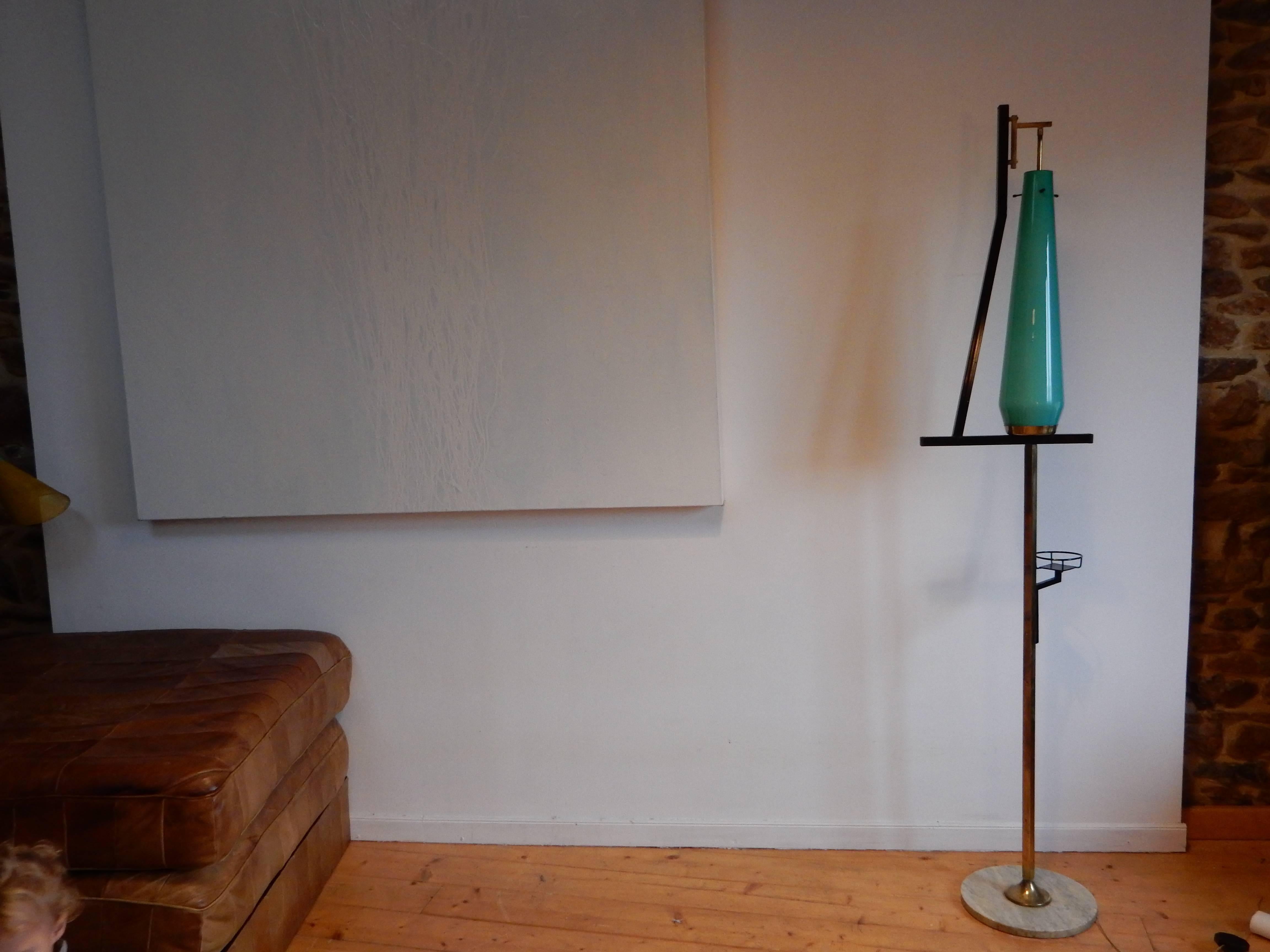 An original Italian floor lamp from the 1960s attribued to  Stilnovo. Old good condition. Base made of Carrara marble, green Murano glass, brass and black lacquered steel.