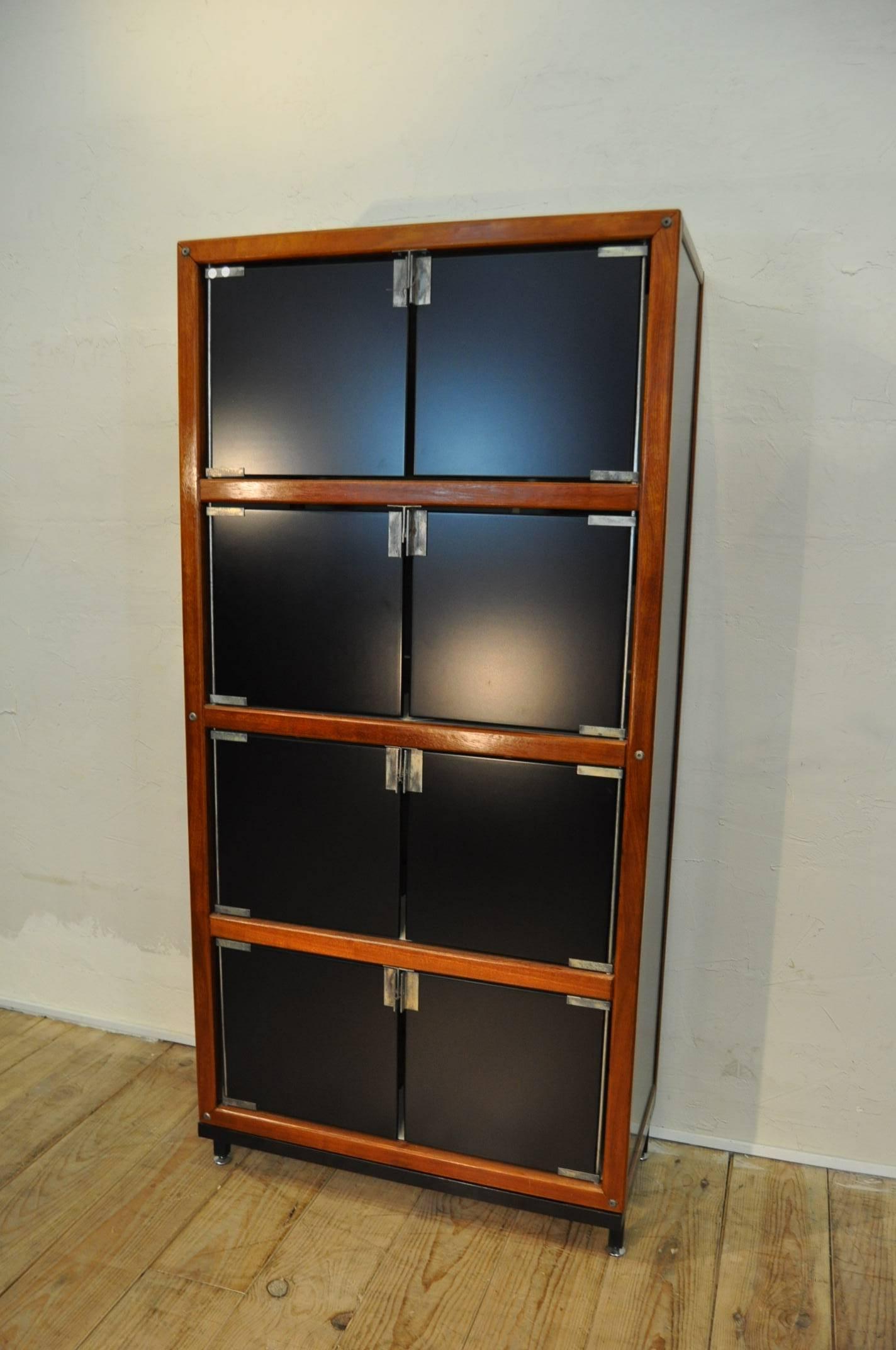 A very famous cabinet by Andre Sornay made of mahogany and lacquered isorel doors circa 1960 in very good condition.