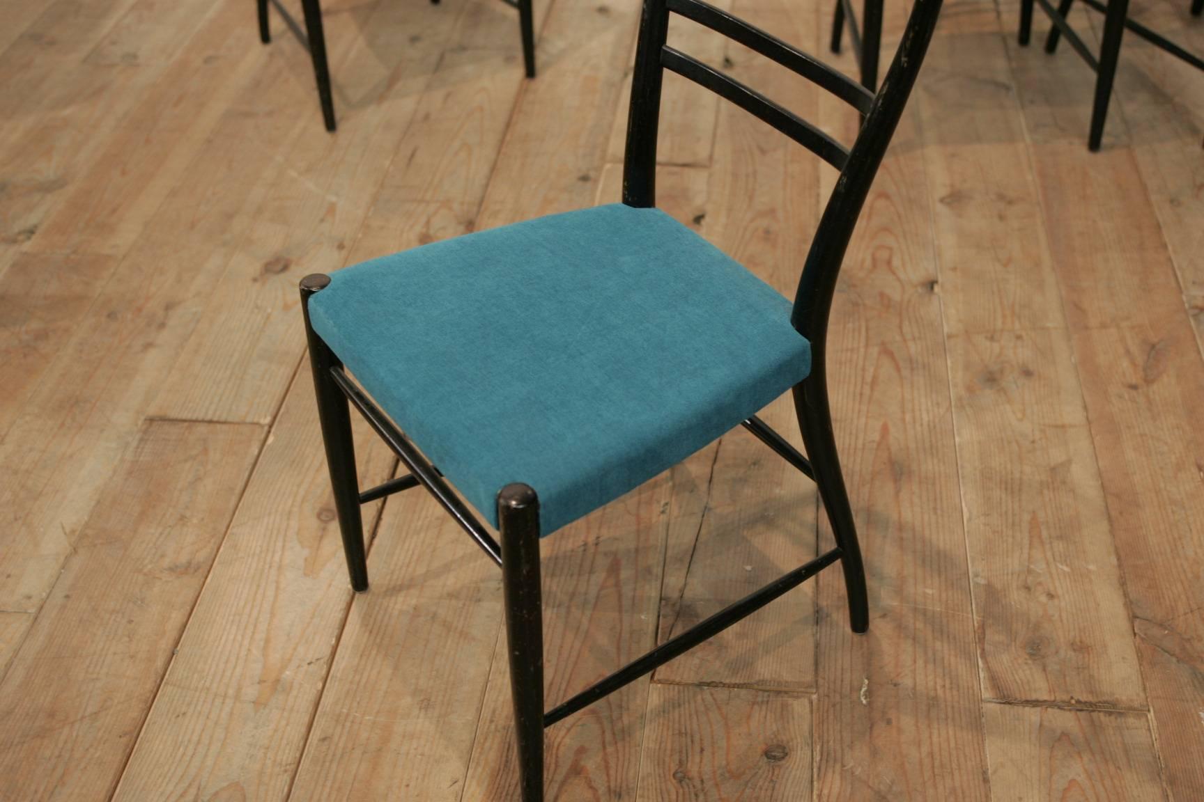 A typical 1960s set of four Danish chairs with new upholstery model 