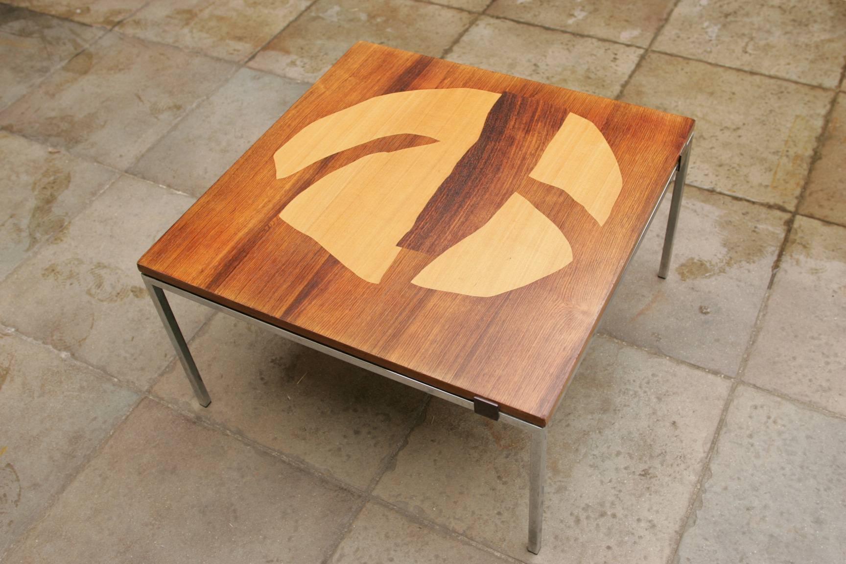 A very rare and beautiful coffee table created by Alain Richard with a draw made of several veneer wood (including palisander) 
base made of steel with four square of 