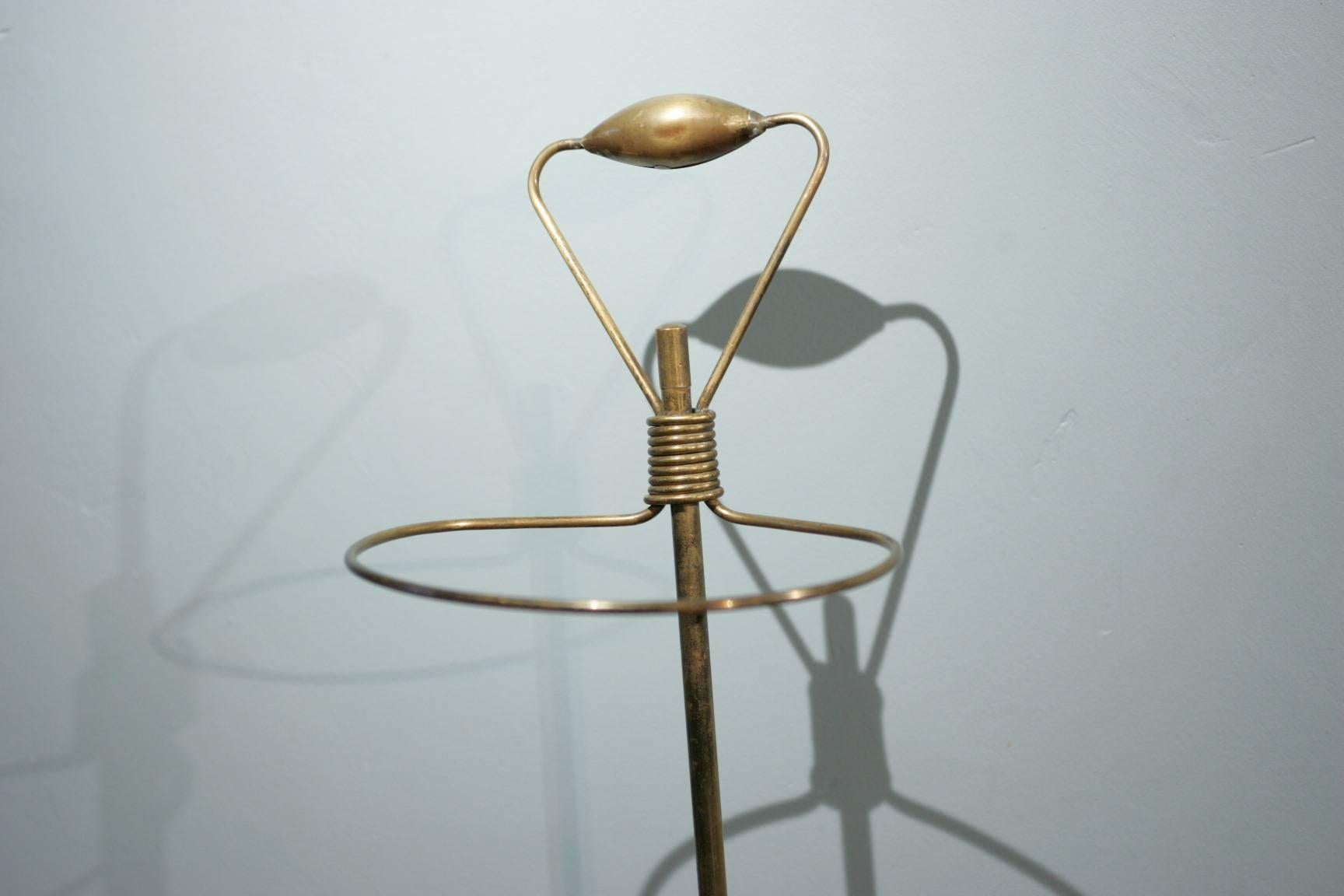 An original umbrella-Stand by Mathieu Mategot made of brass and black steel in good condition from 1950.