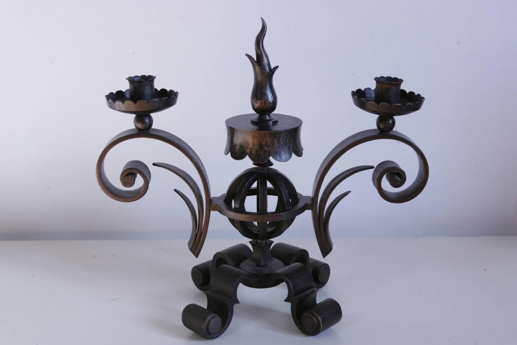 A beautiful néo classic fired iron candlesticks made and signed by Gilbert Poillerat, circa 1940 in very good original condition.